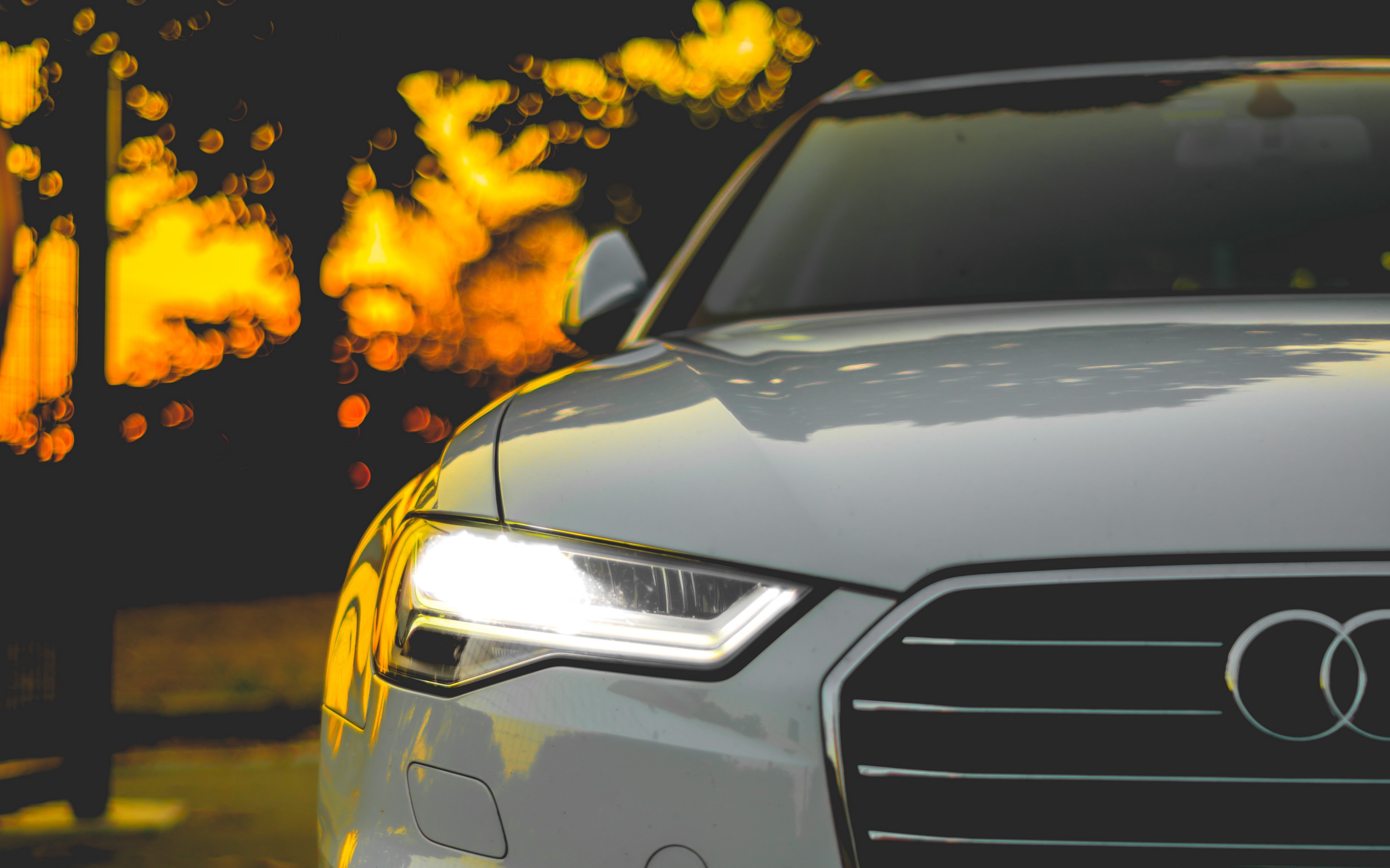 Audi car headlights and grille at night HD Wallpaper