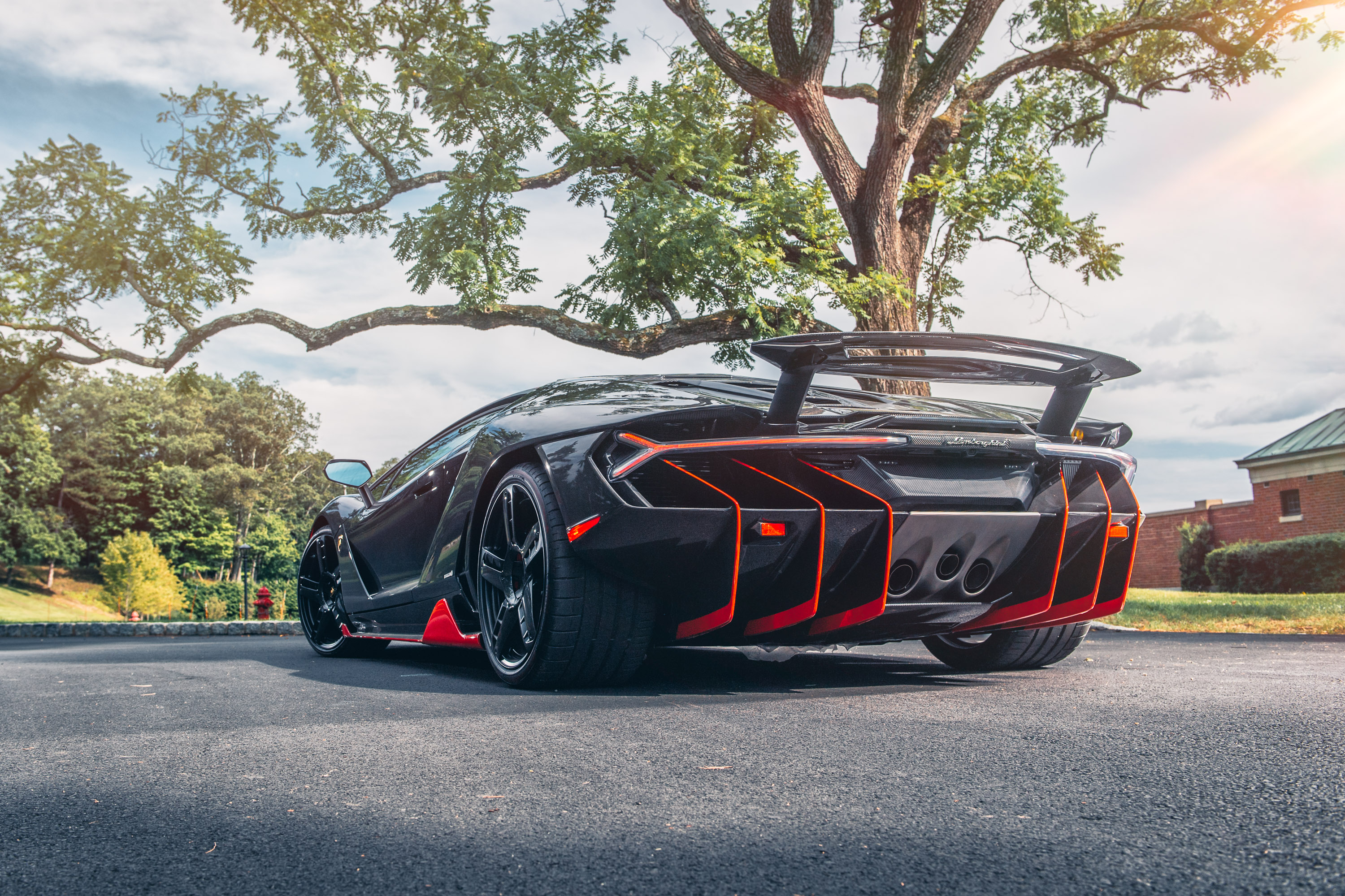 Black Lamborghini Centenario with Orange Accents HD Wallpaper