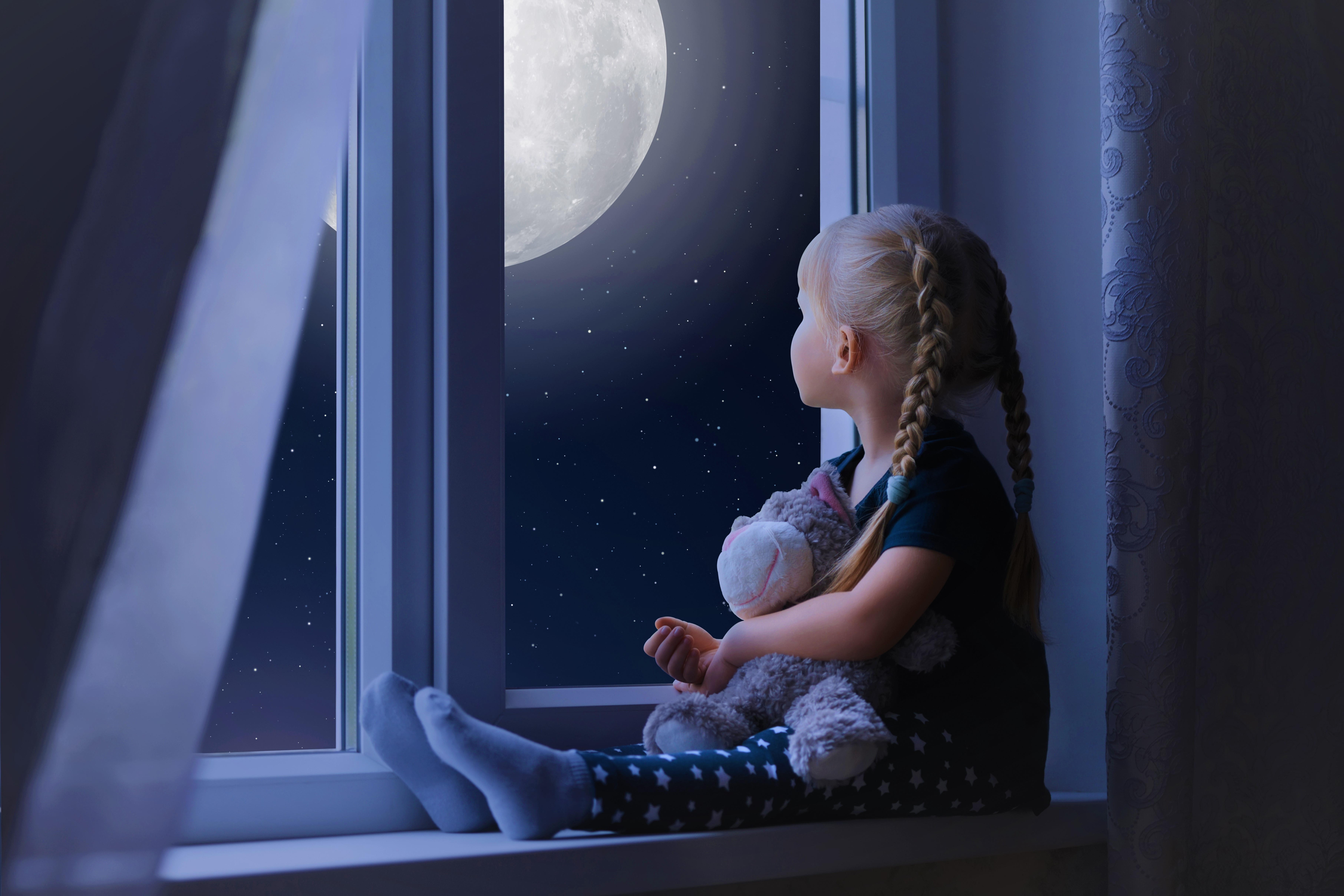 Little girl with pigtails looking at the moon through a window HD Wallpaper