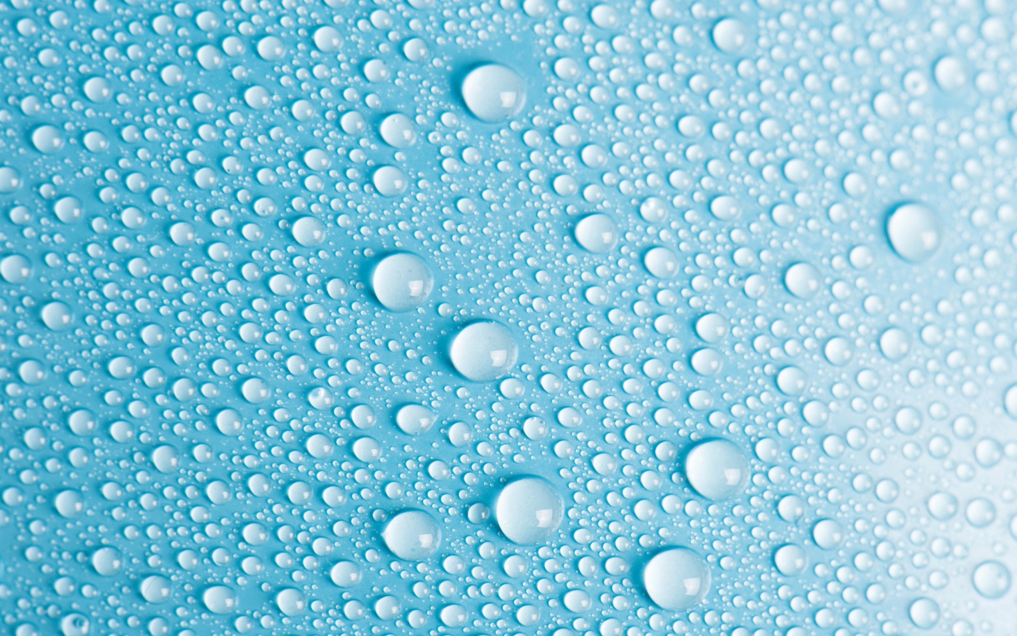 Water droplets on a blue surface HD Wallpaper