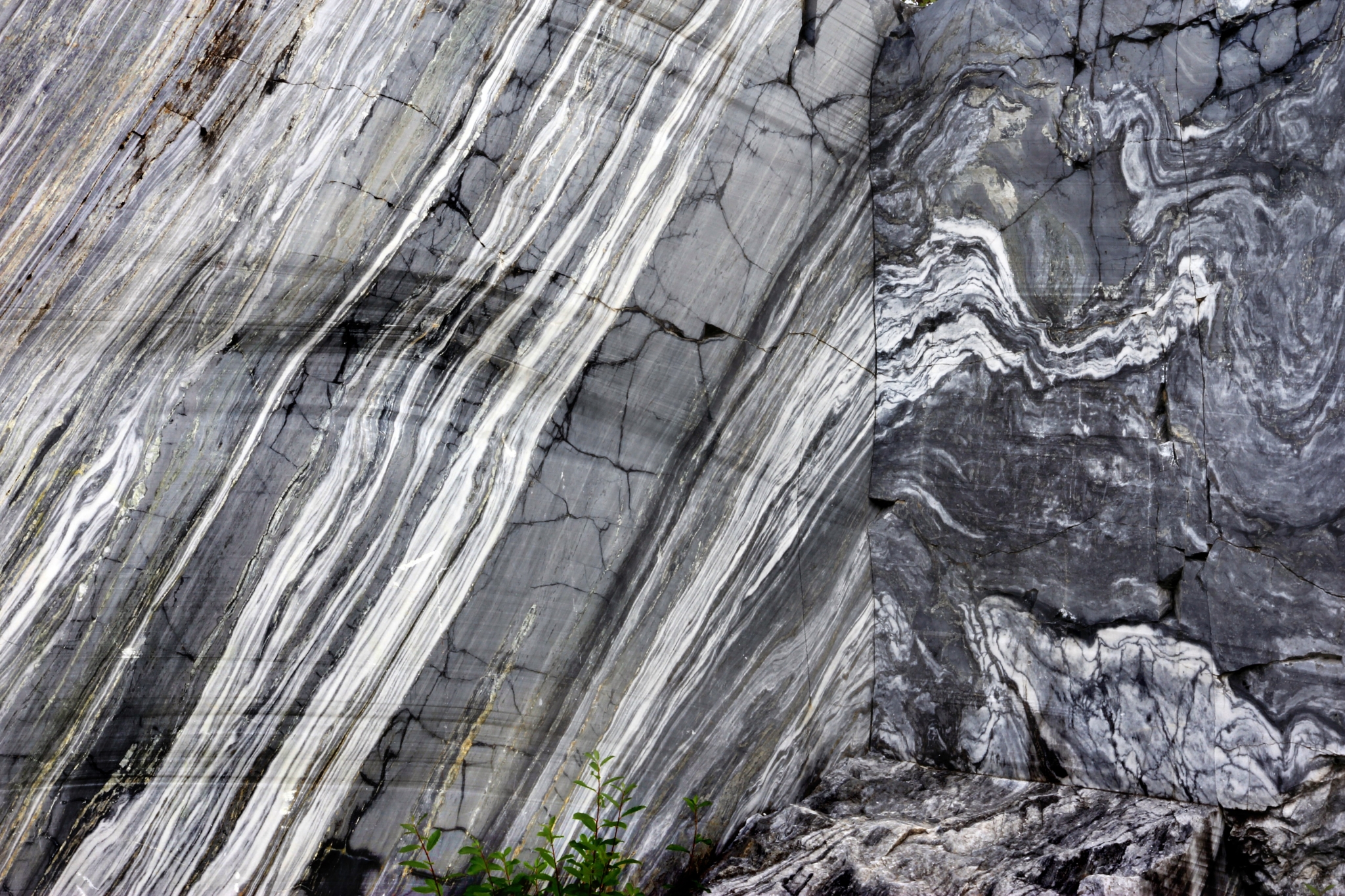 Marble rock formation with distinct striations HD Wallpaper