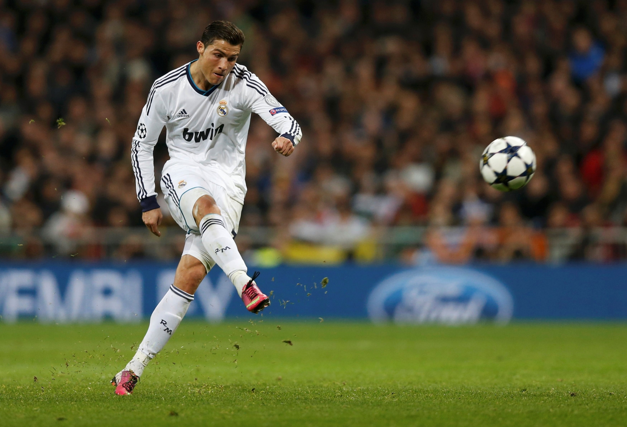 Cristiano Ronaldo kicking a soccer ball HD Wallpaper