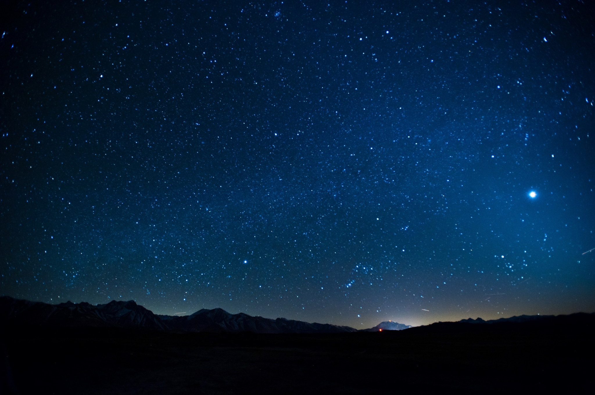 Starry night sky over mountains HD Wallpaper