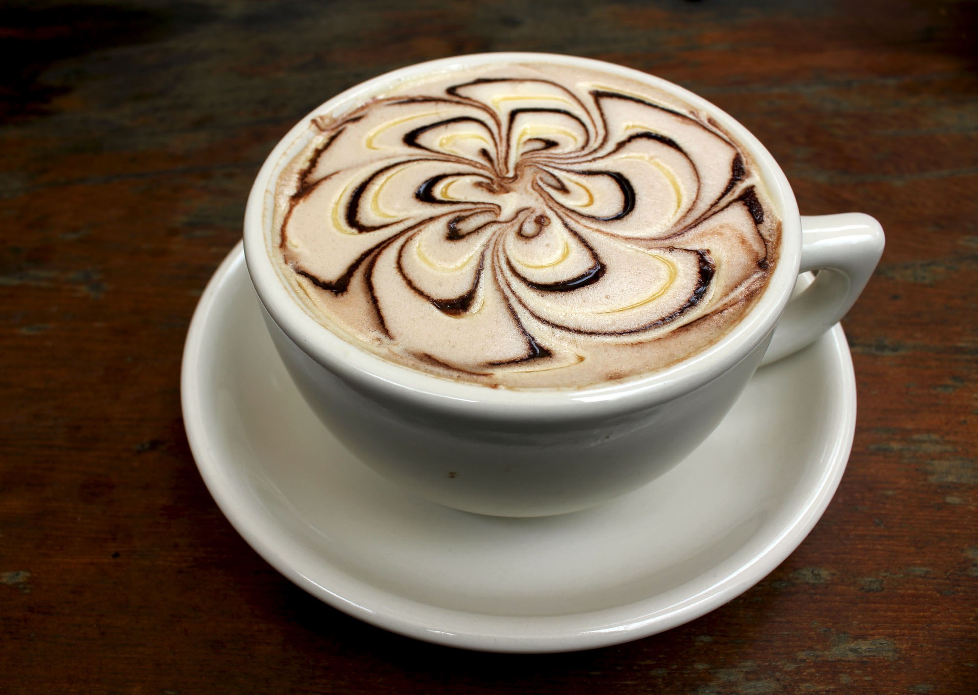 Coffee with chocolate art on top HD Wallpaper