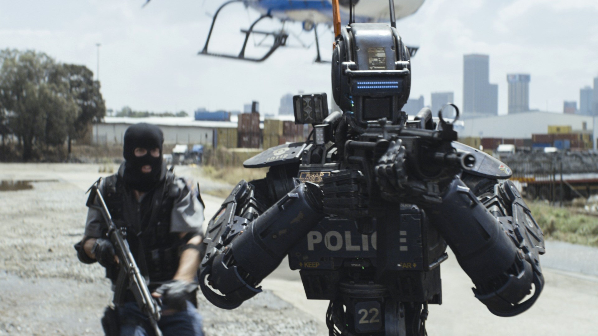 Chappie robot and man with gun HD Wallpaper