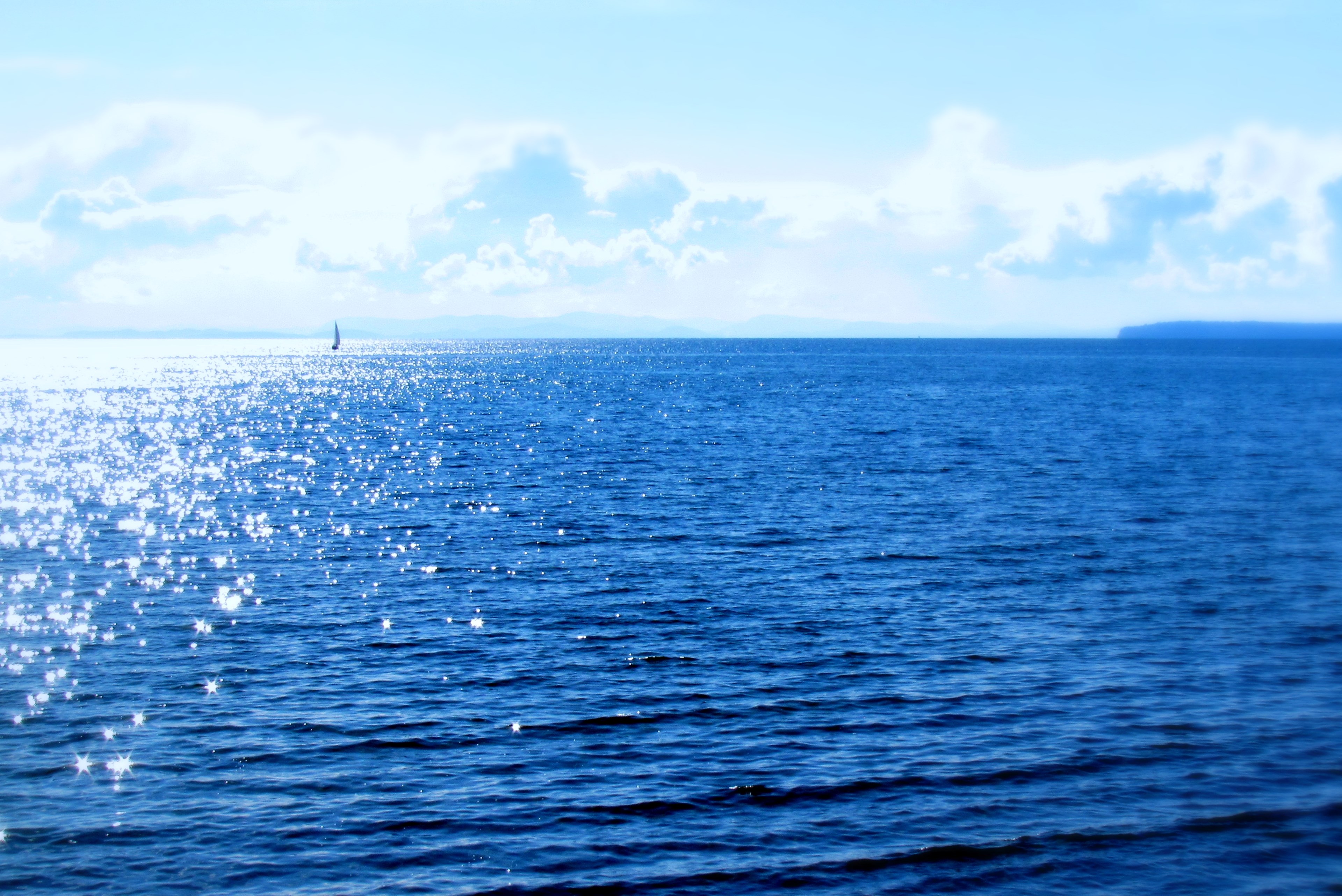 Ocean with sailboat and clouds HD Wallpaper