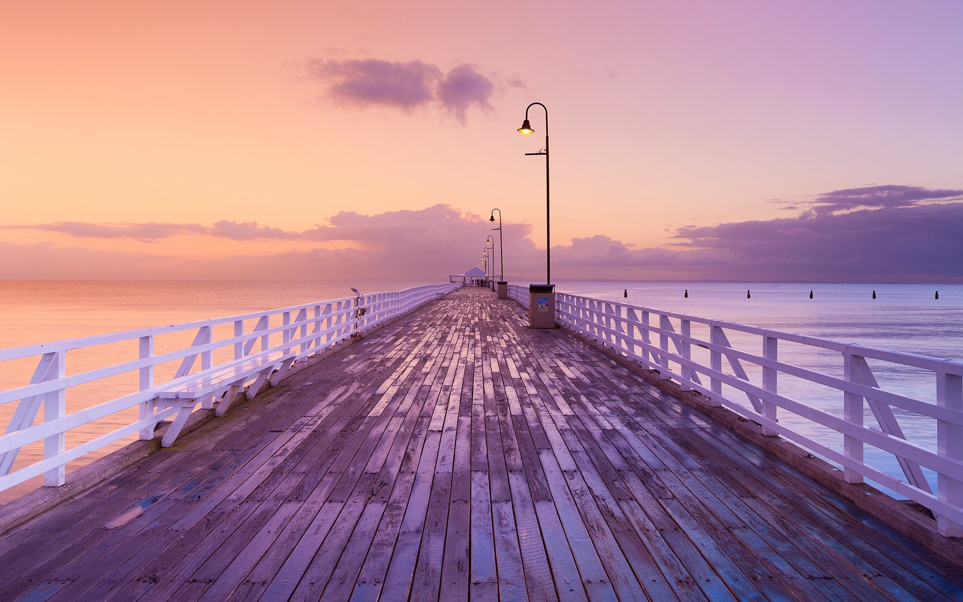 Wooden pier with white railings at sunset HD Wallpaper