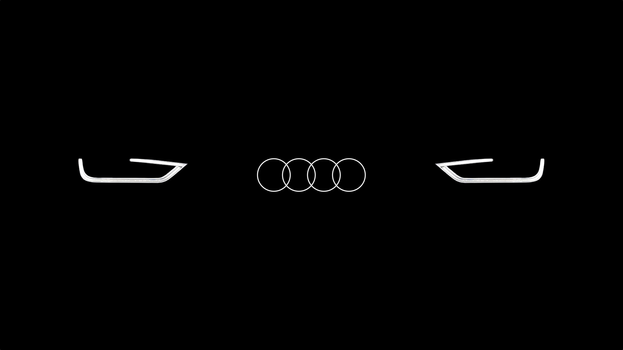 Audi logo and car lights on black background HD Wallpaper