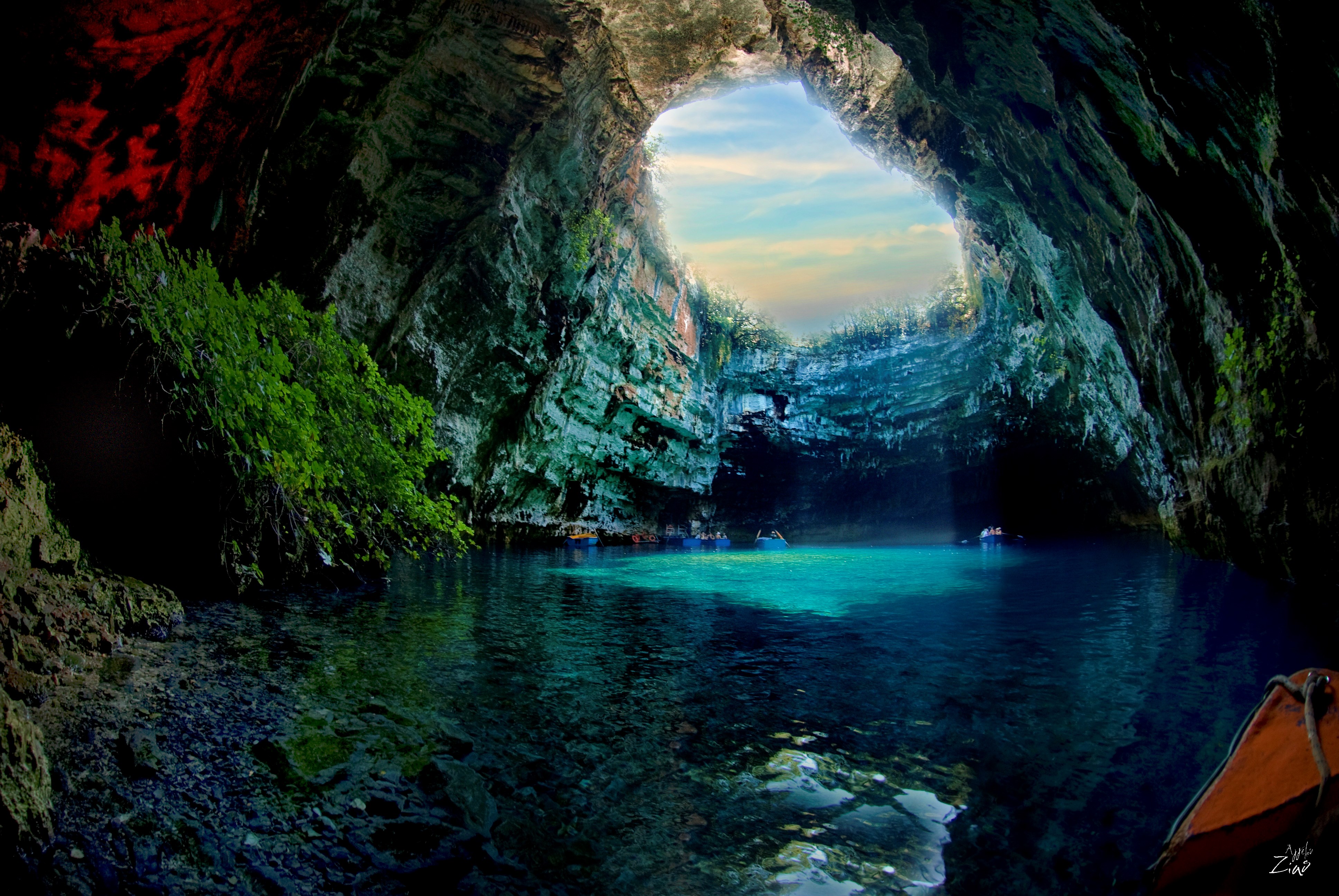Melissani Cave with boats and turquoise water HD Wallpaper
