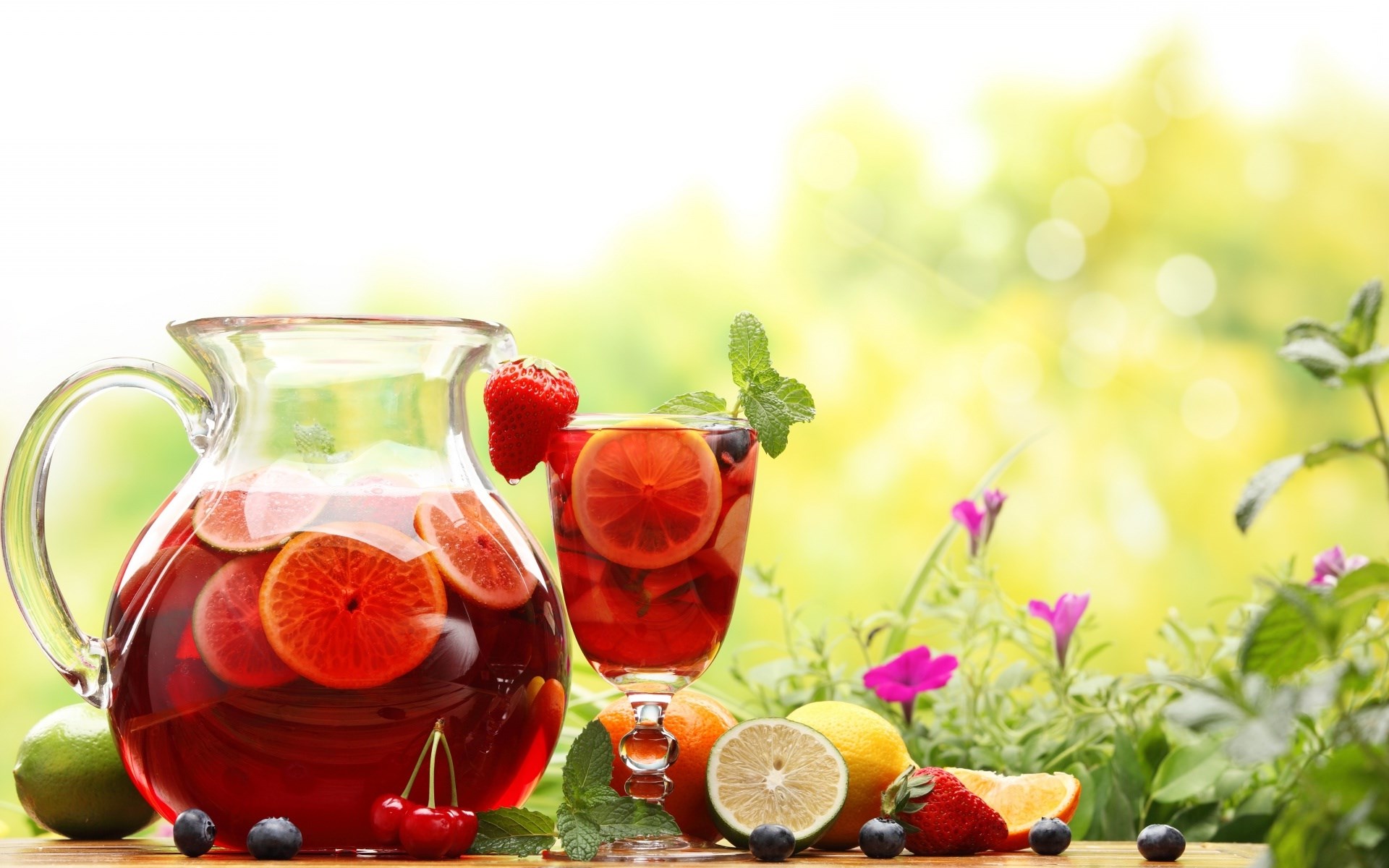 Pitcher and glass of fruit punch with fruits HD Wallpaper