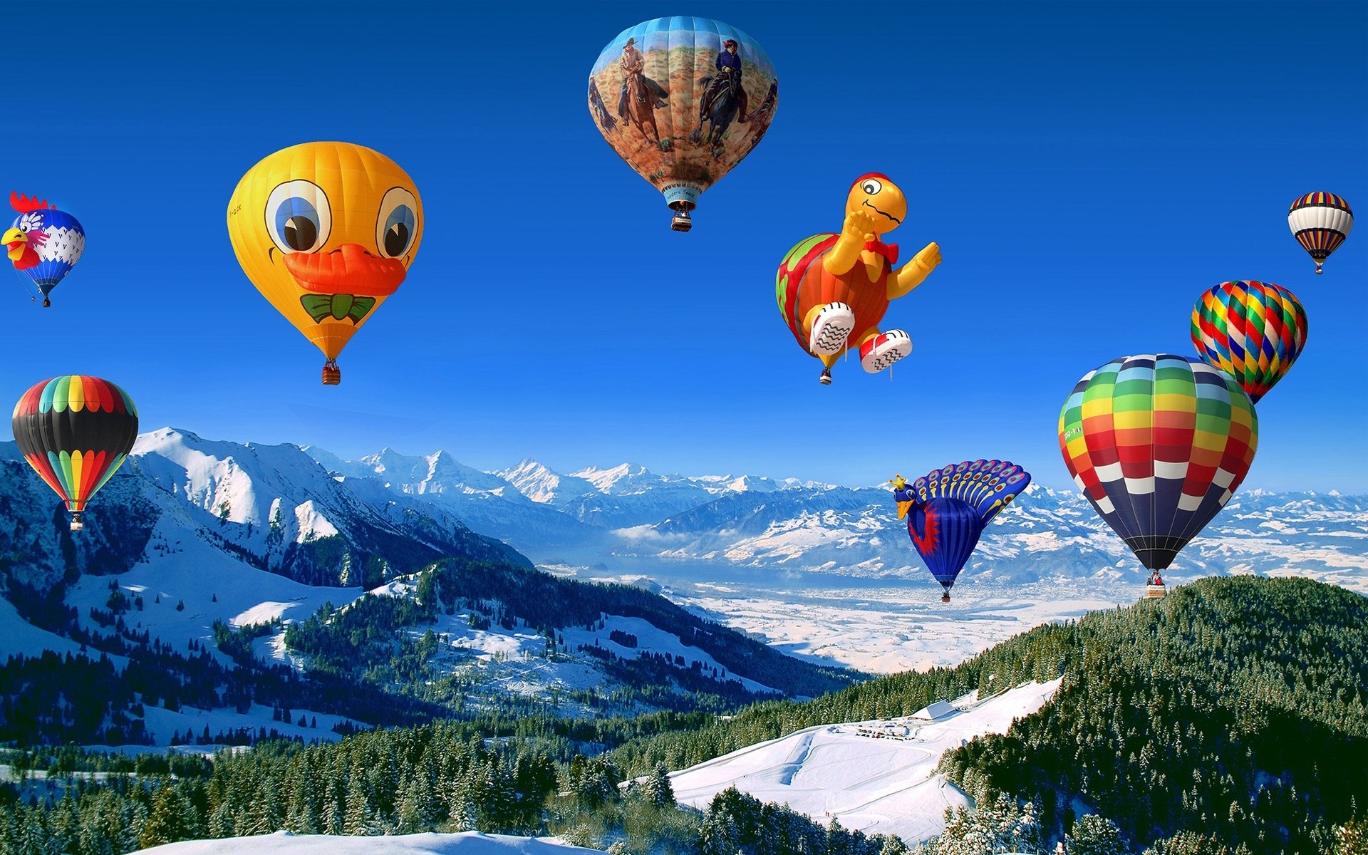 Hot air balloons over snowy mountains HD Wallpaper