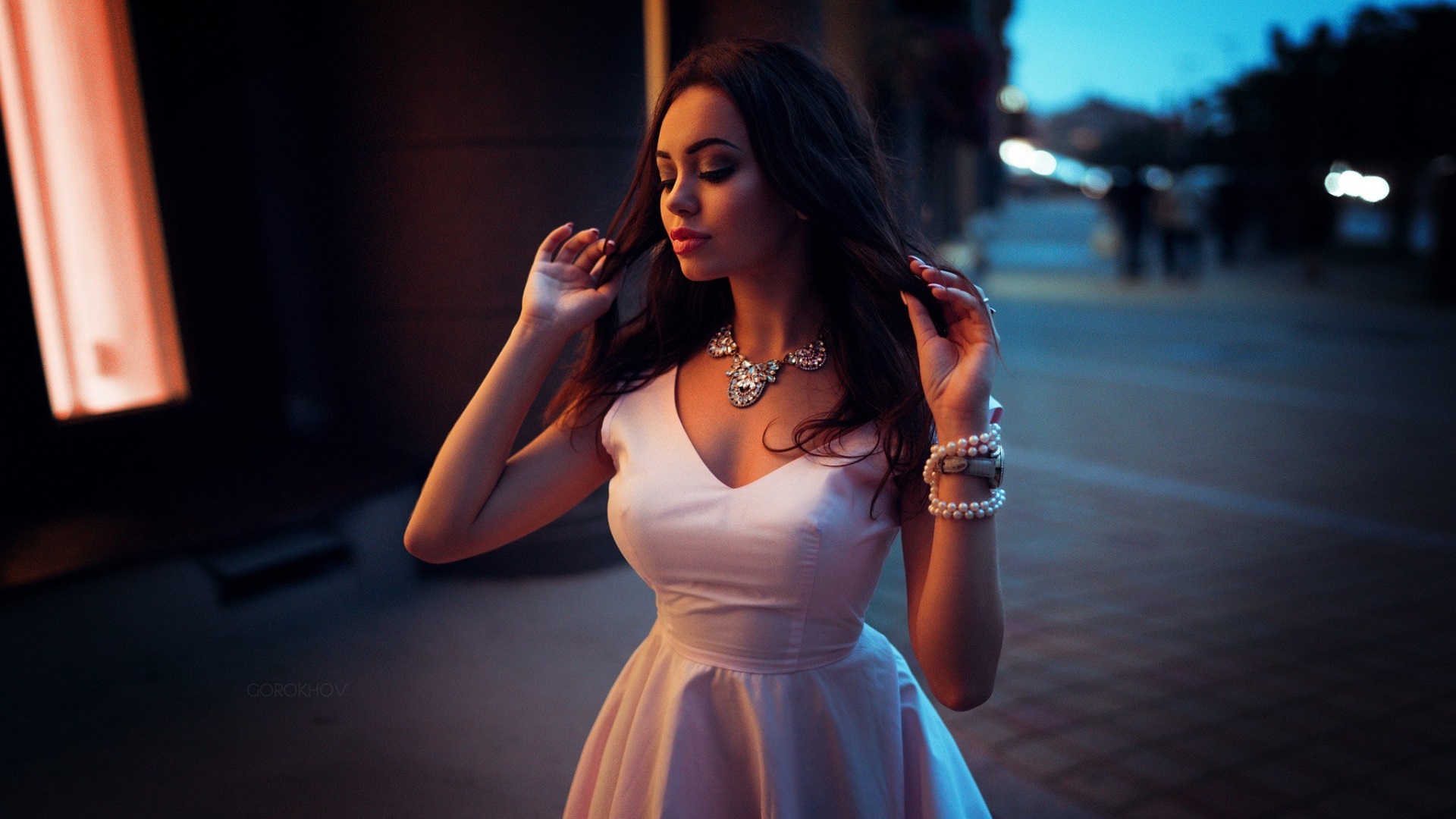 Elegant Woman in White Dress at Dusk HD Wallpaper
