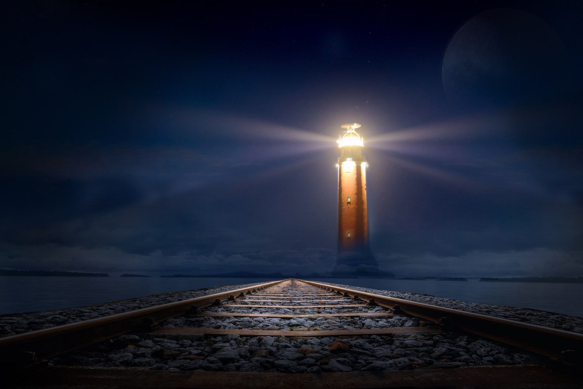 Lighthouse at night with train tracks HD Wallpaper