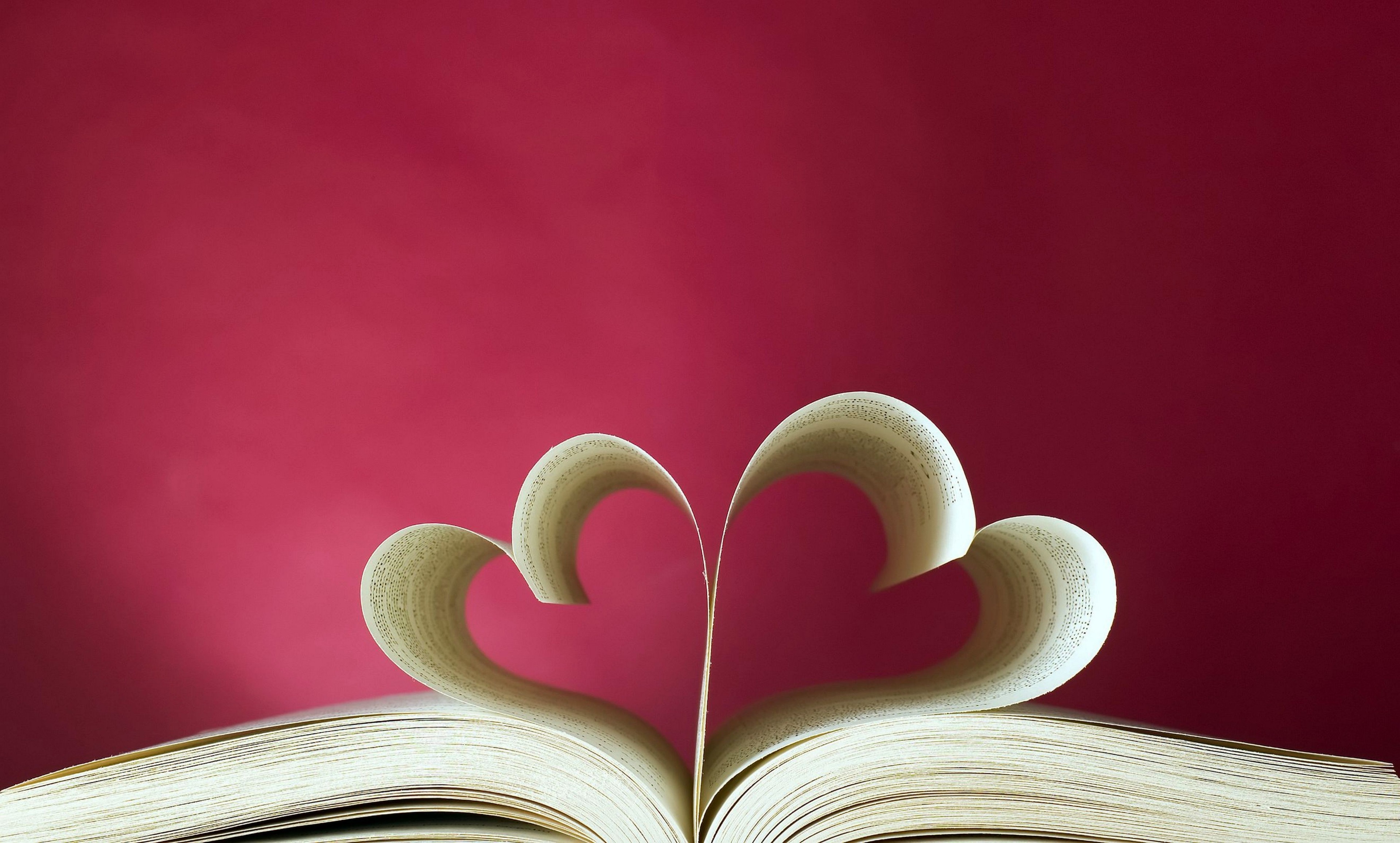 Love hearts made from book pages on a pink background HD Wallpaper