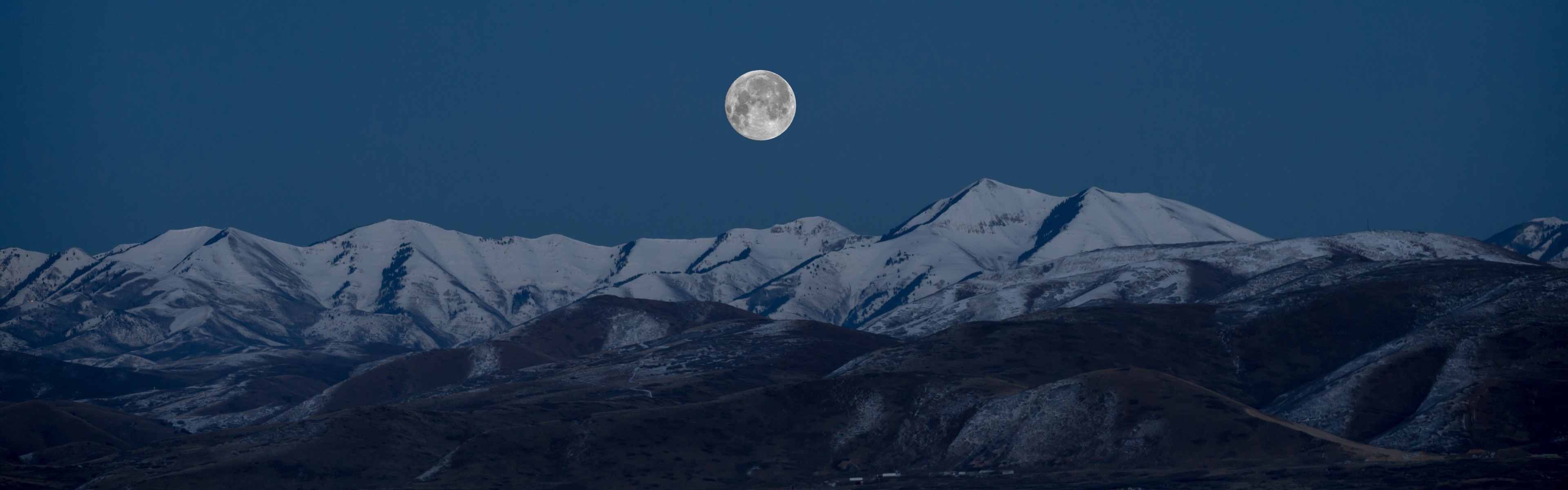 Full moon over snow-capped mountains at night HD Wallpaper