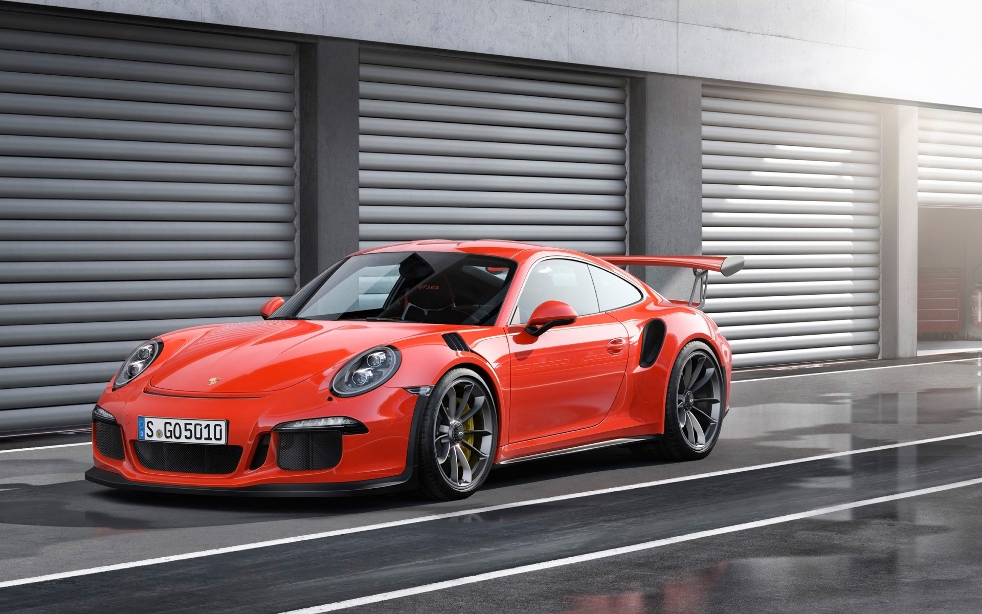 Orange Porsche 911 GT3 RS on a Racetrack HD Wallpaper