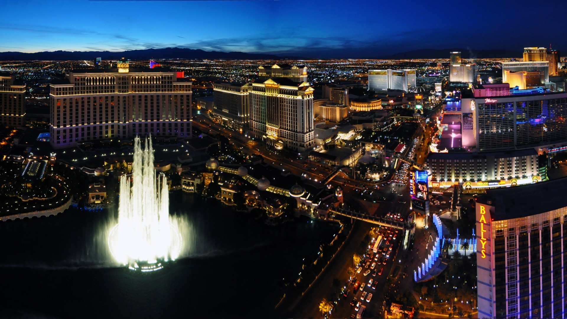 Las Vegas Strip cityscape with Bellagio fountains at night HD Wallpaper