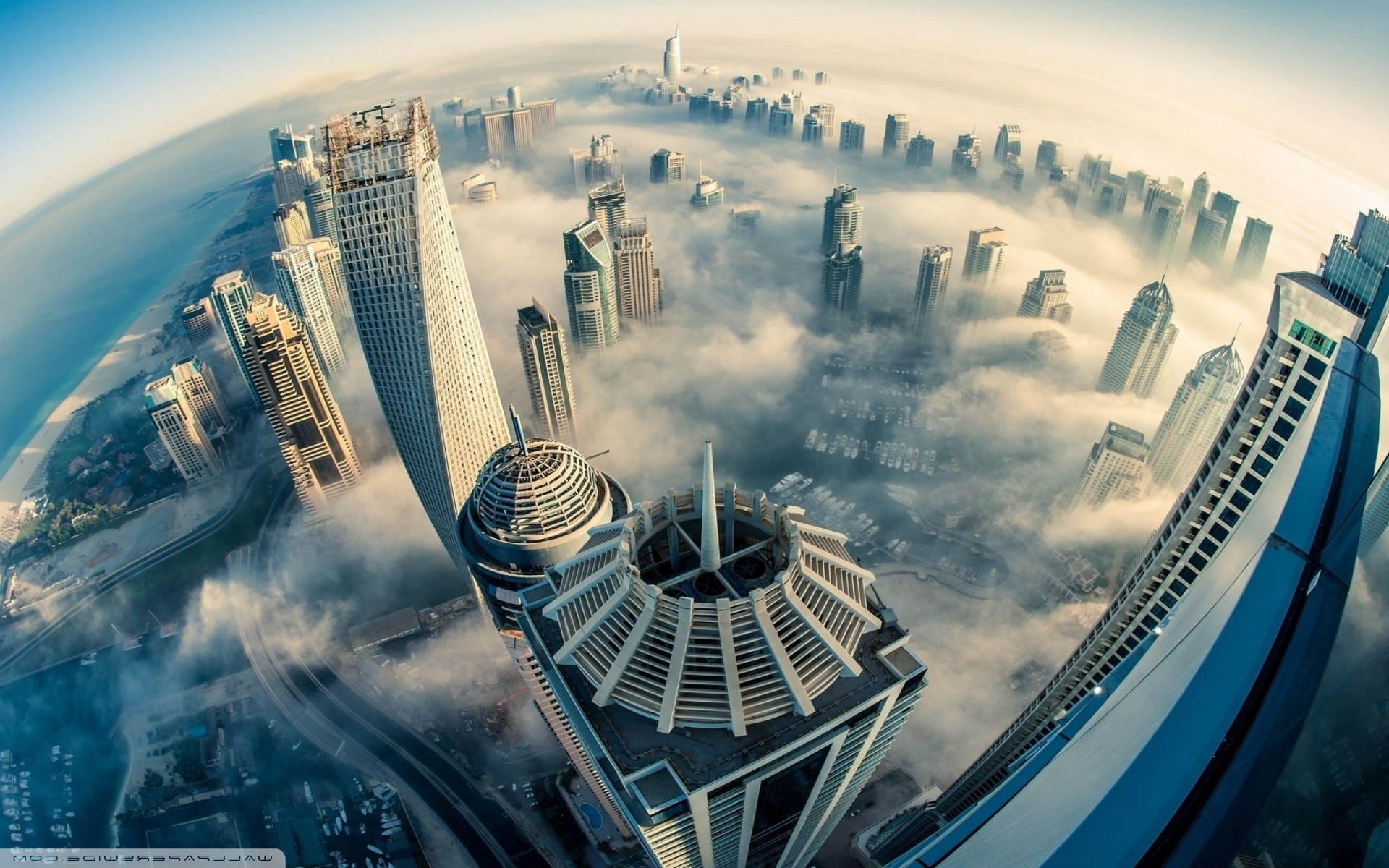 Dubai skyscrapers shrouded in clouds HD Wallpaper