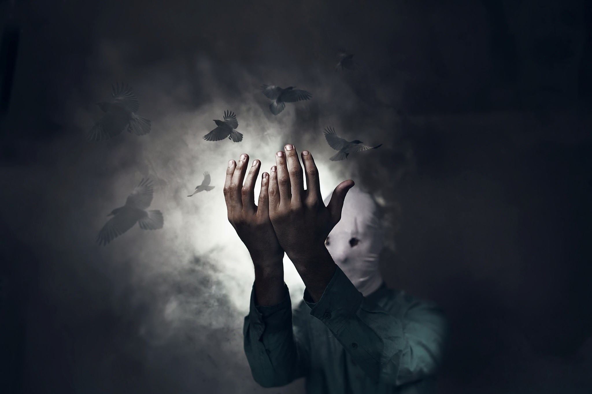 Person with masked face and hands raised with birds flying HD Wallpaper