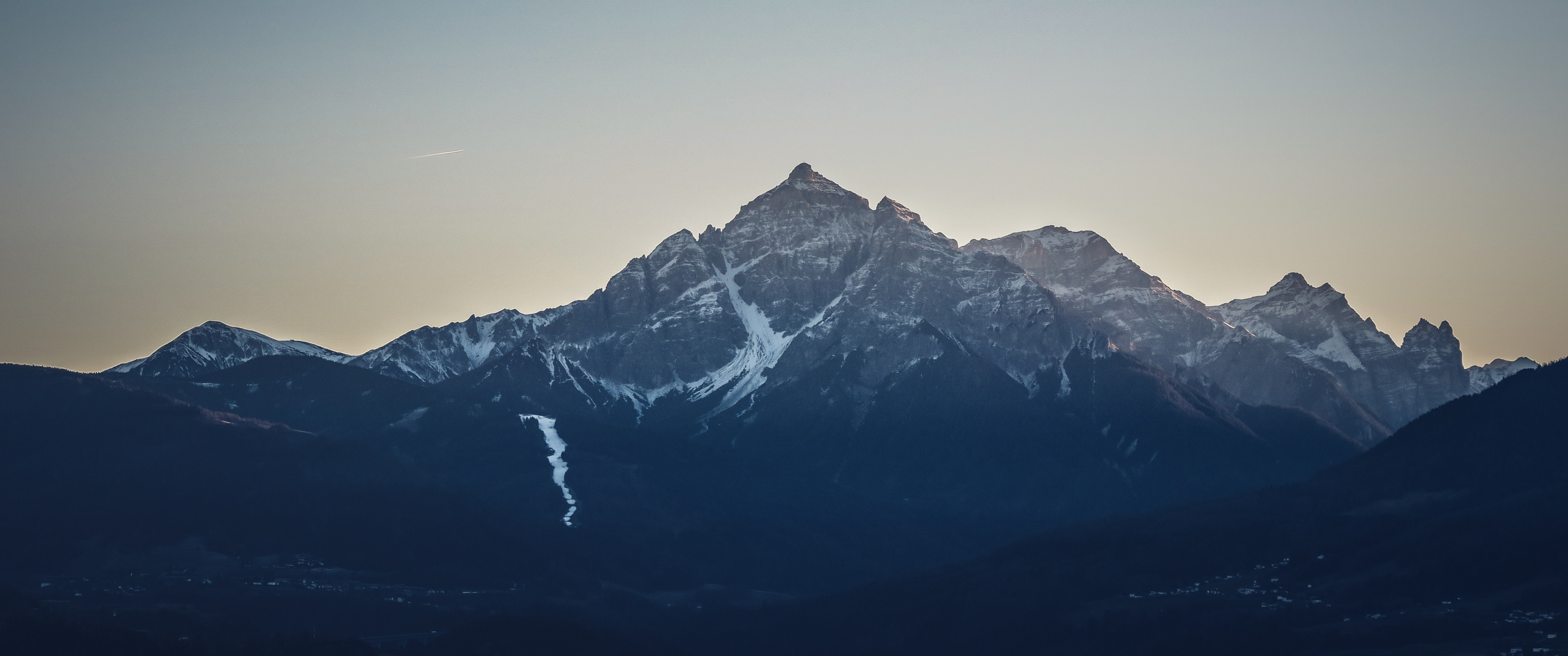 Snow-capped mountains at dusk HD Wallpaper