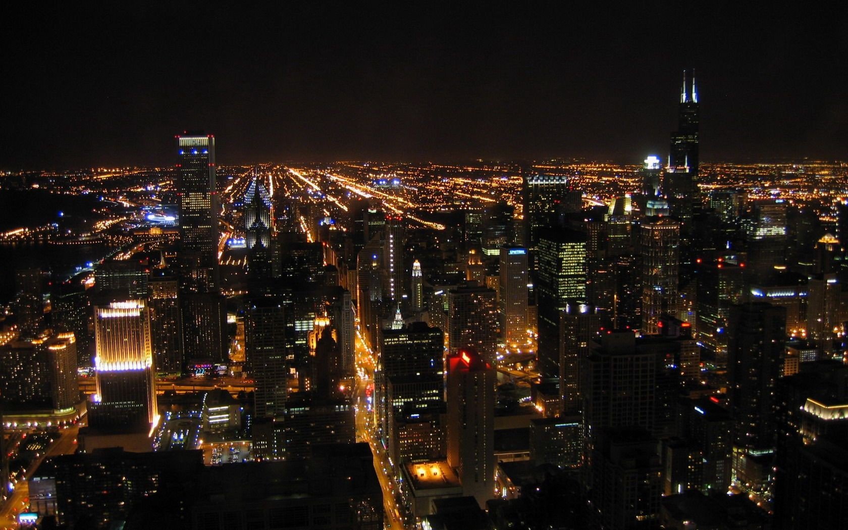 Night cityscape with illuminated skyscrapers and city lights HD Wallpaper