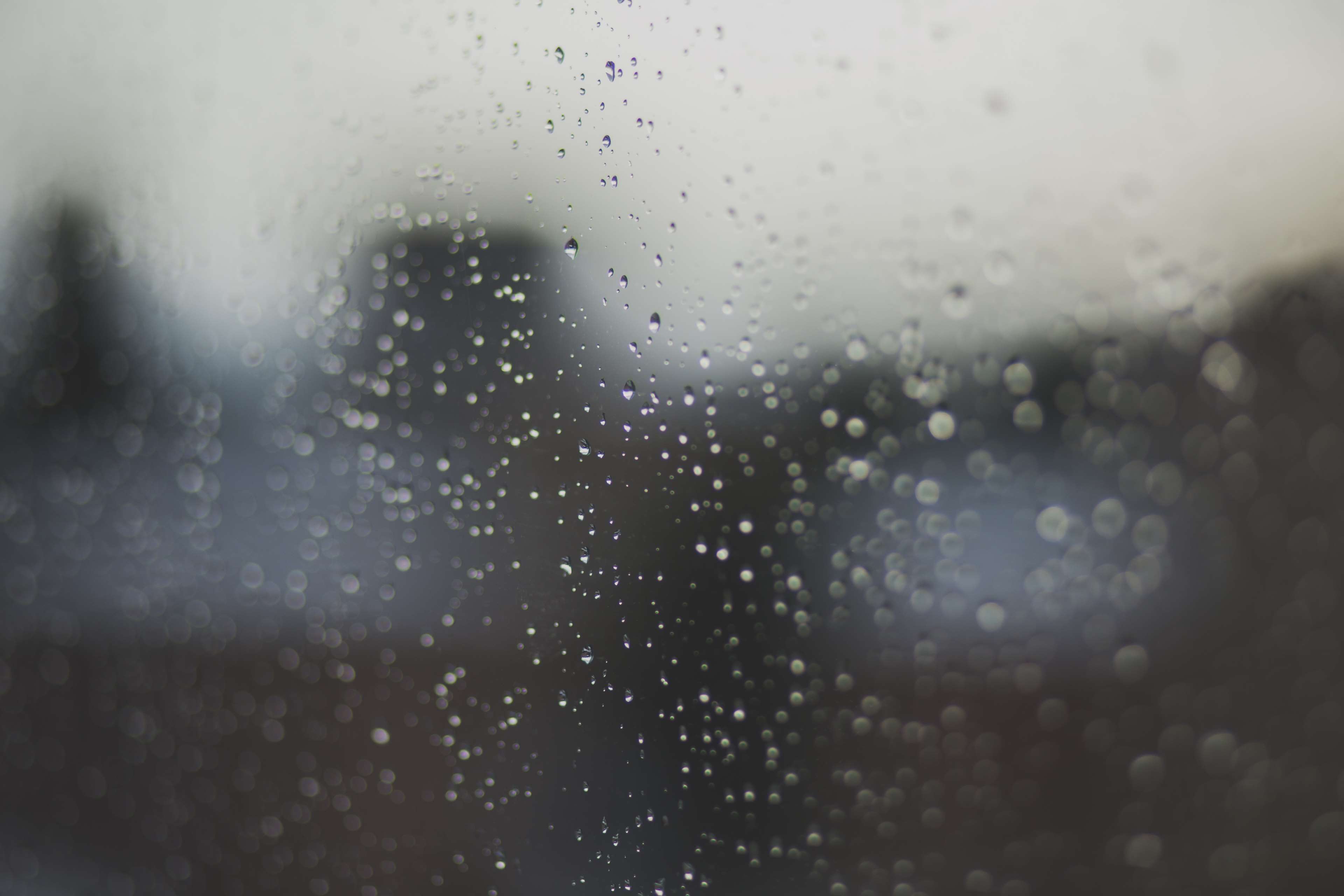 Raindrops on a window at night HD Wallpaper