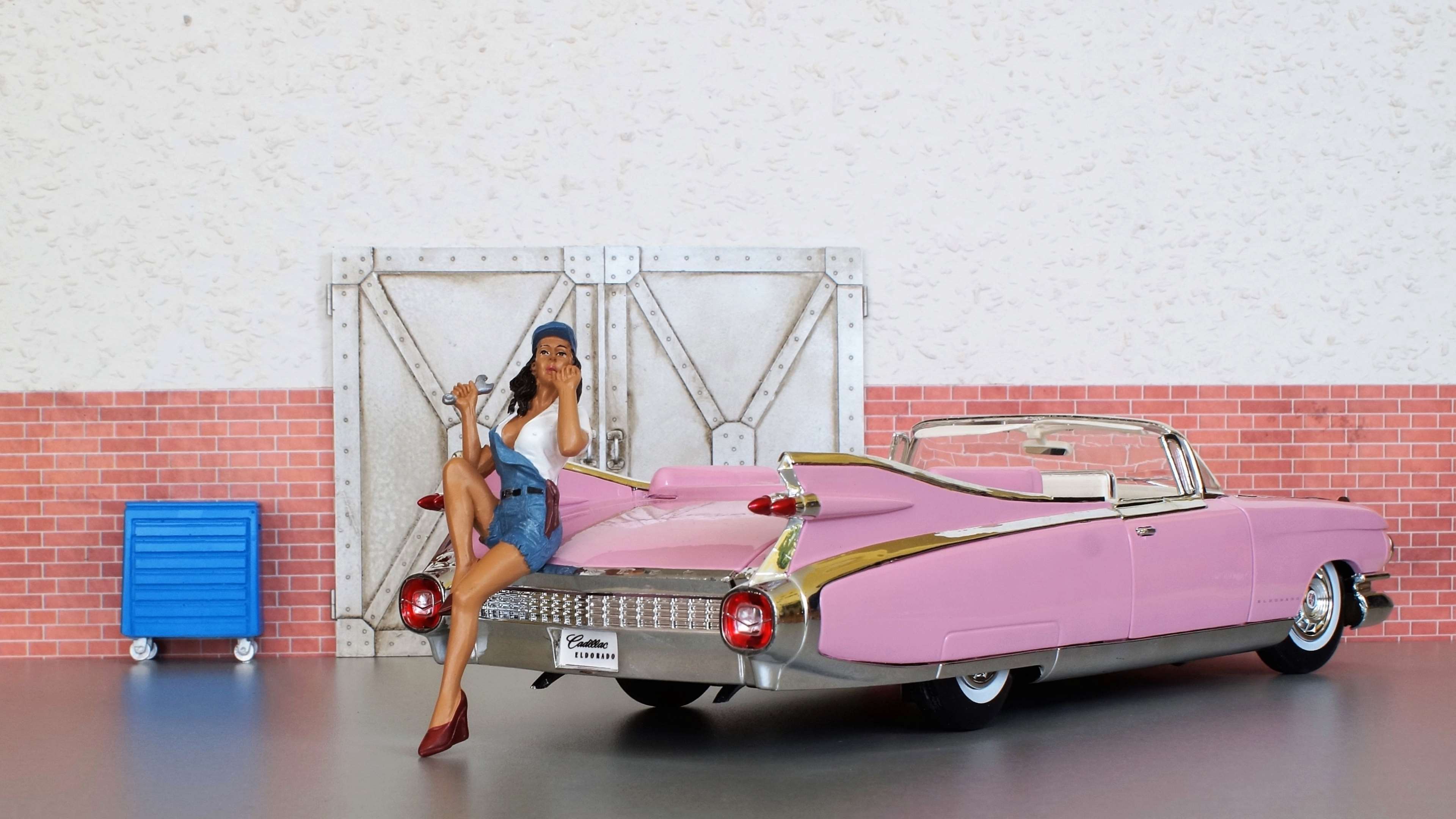 Pin-up mechanic with pink Cadillac Eldorado HD Wallpaper
