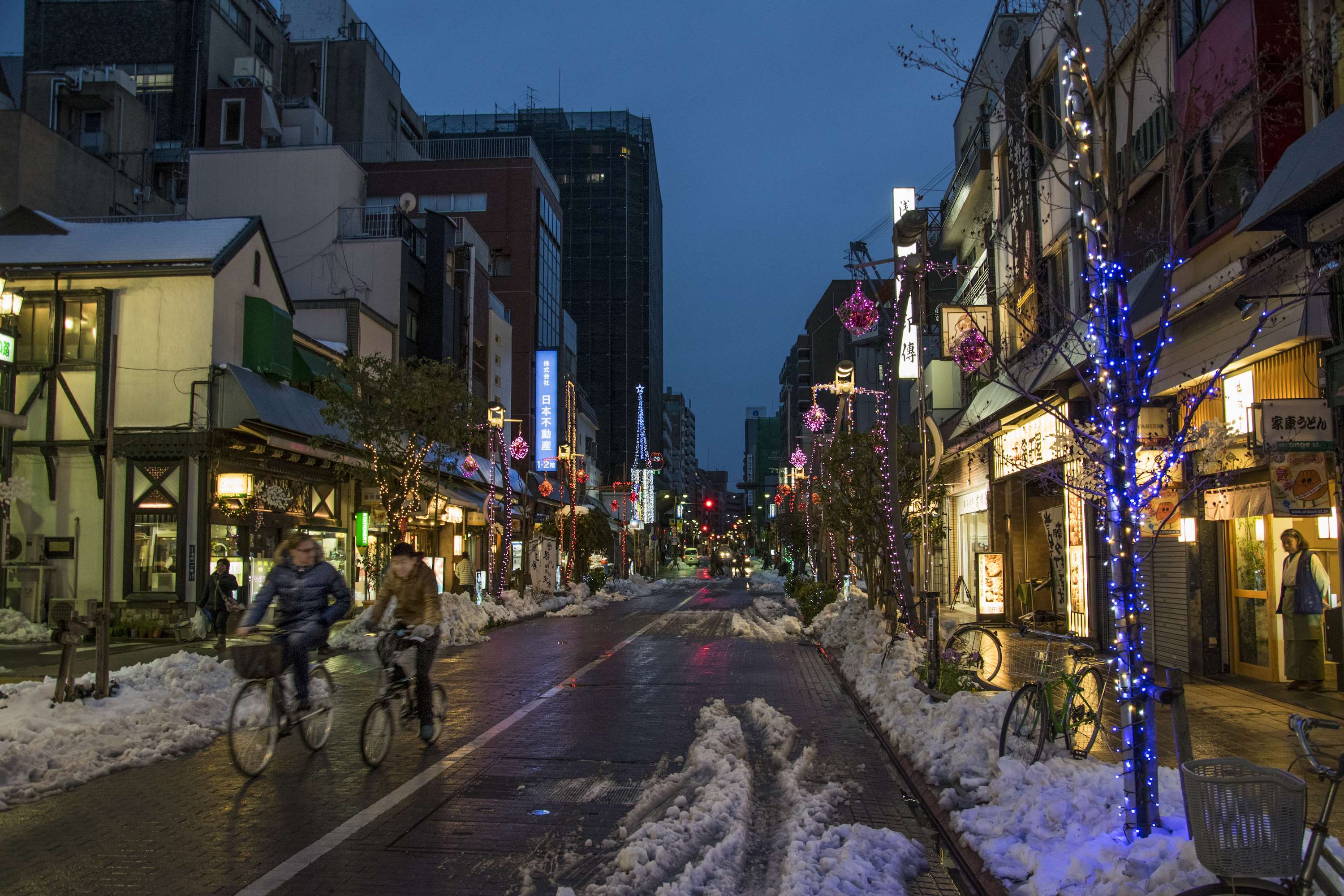 Tokyo street at night with snow and lights HD Wallpaper
