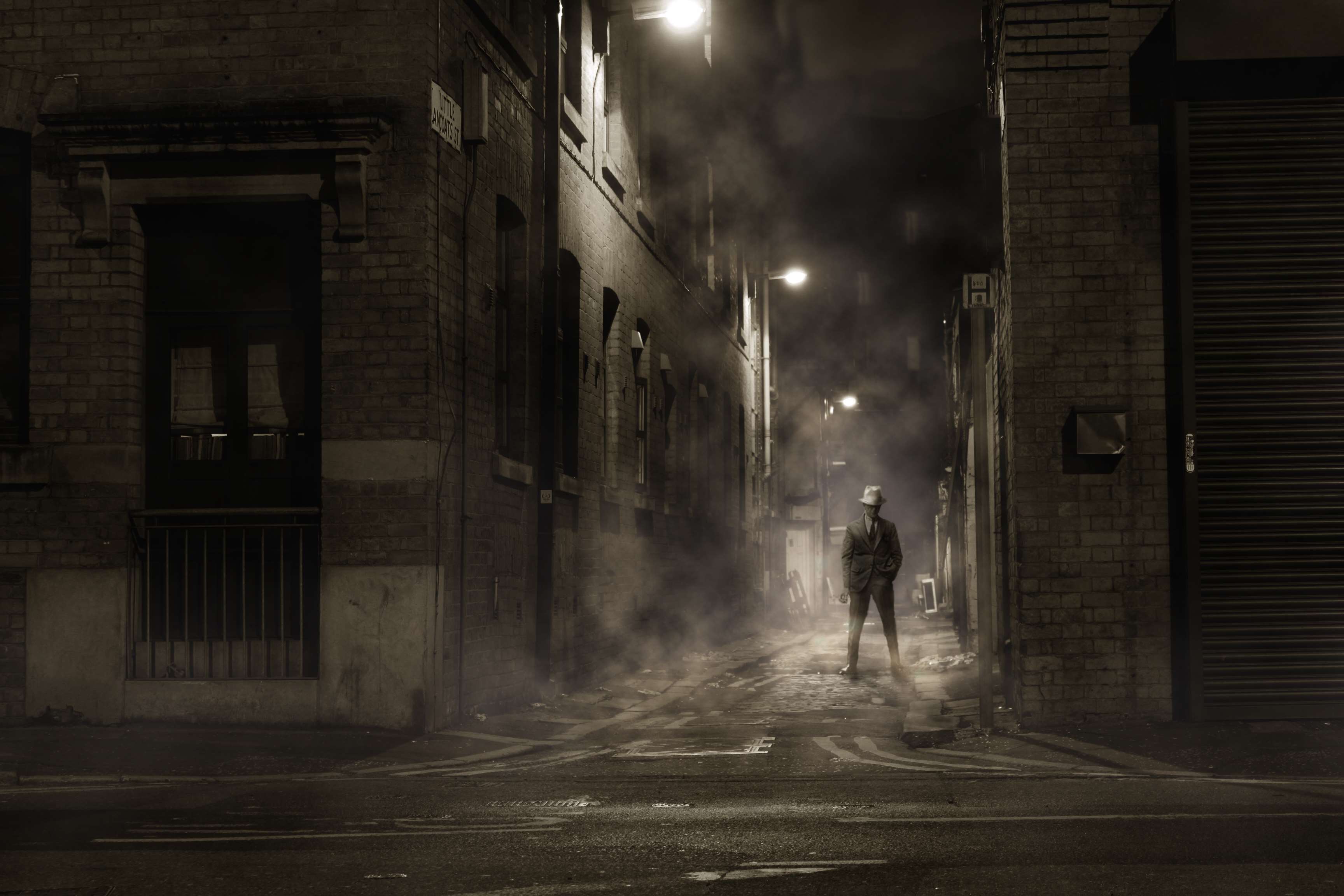 Man in a hat in a foggy alley at night HD Wallpaper