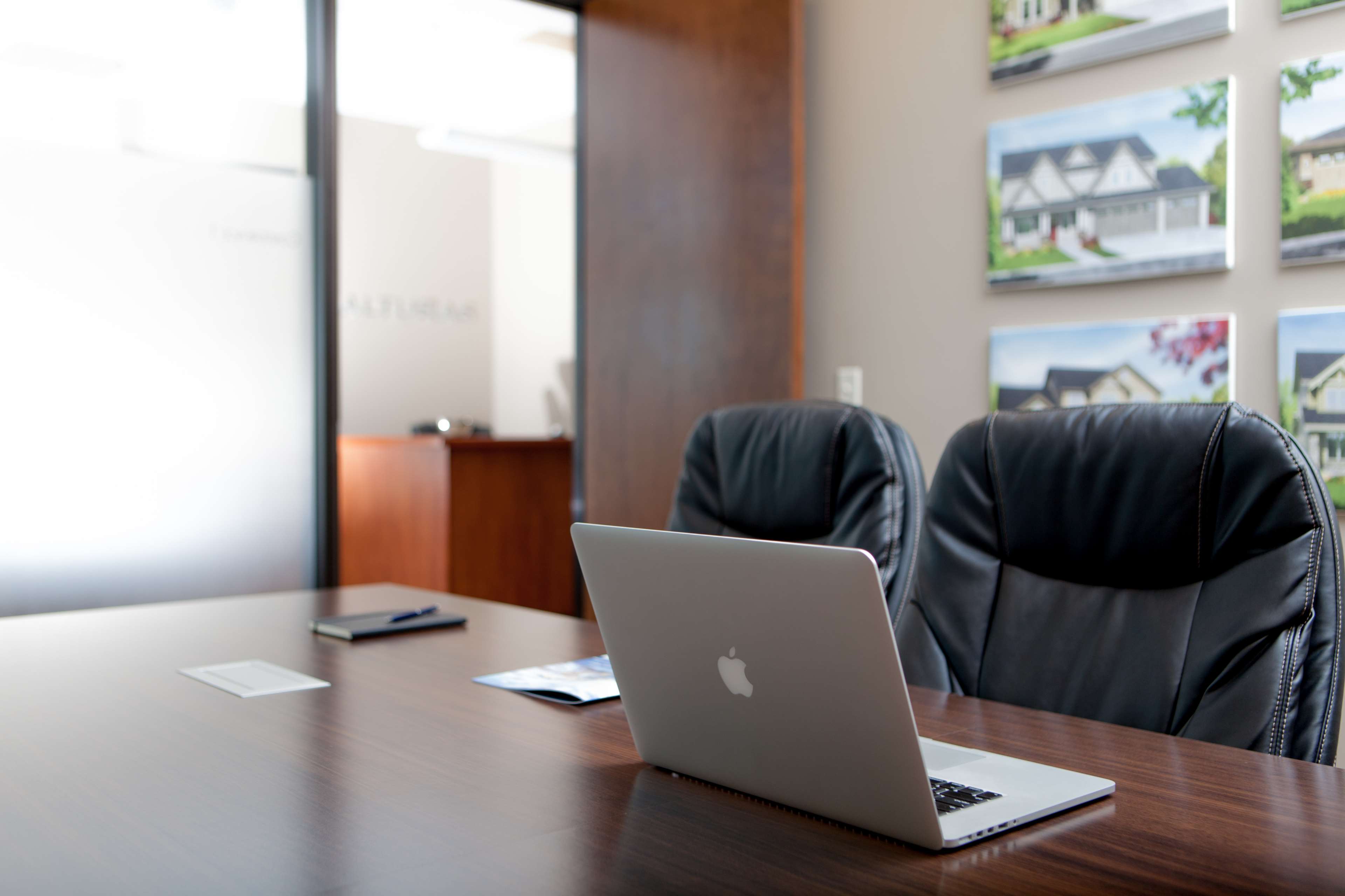 Office meeting room with laptop and paintings HD Wallpaper