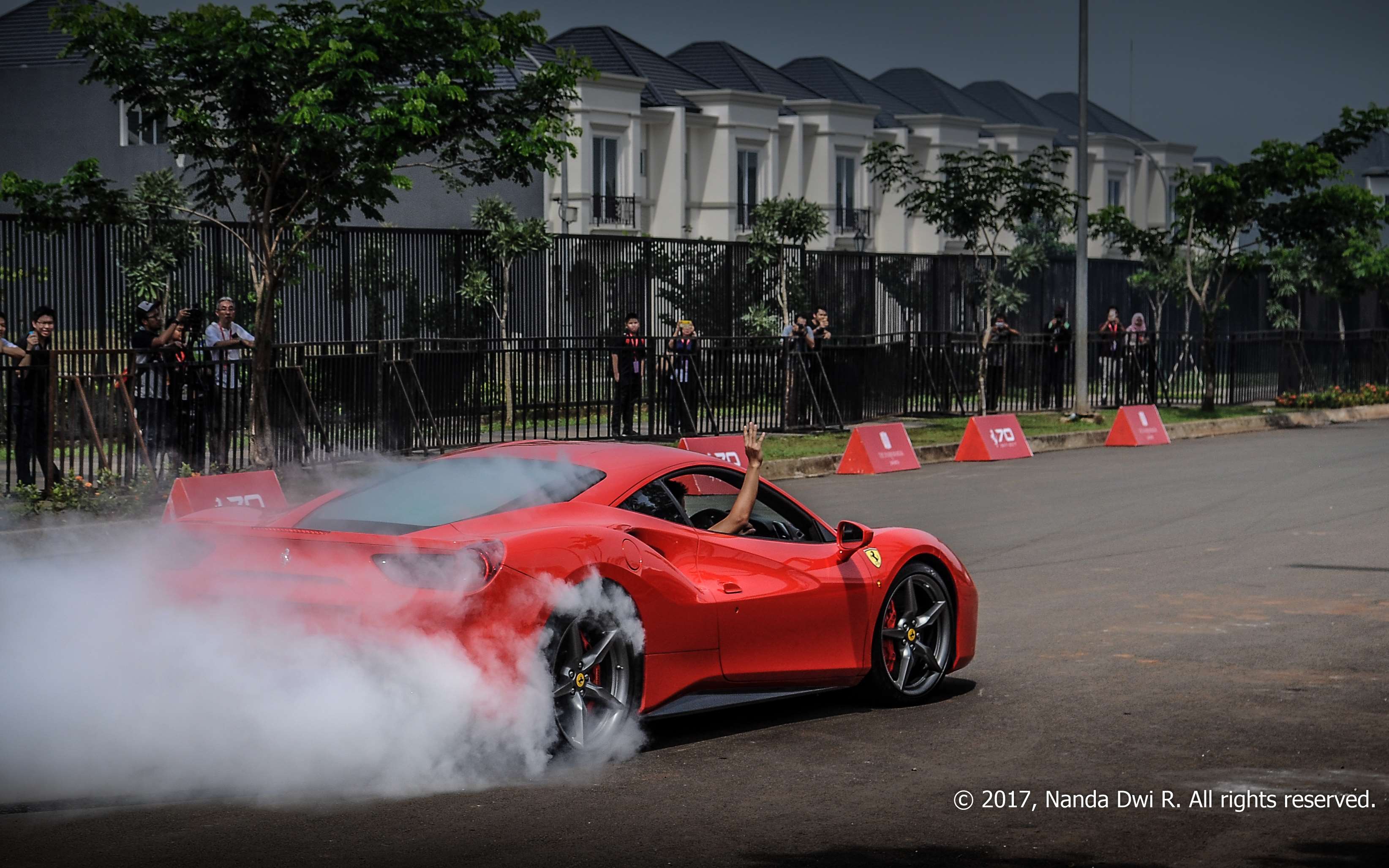 Red Ferrari 488 GTB performing a burnout HD Wallpaper