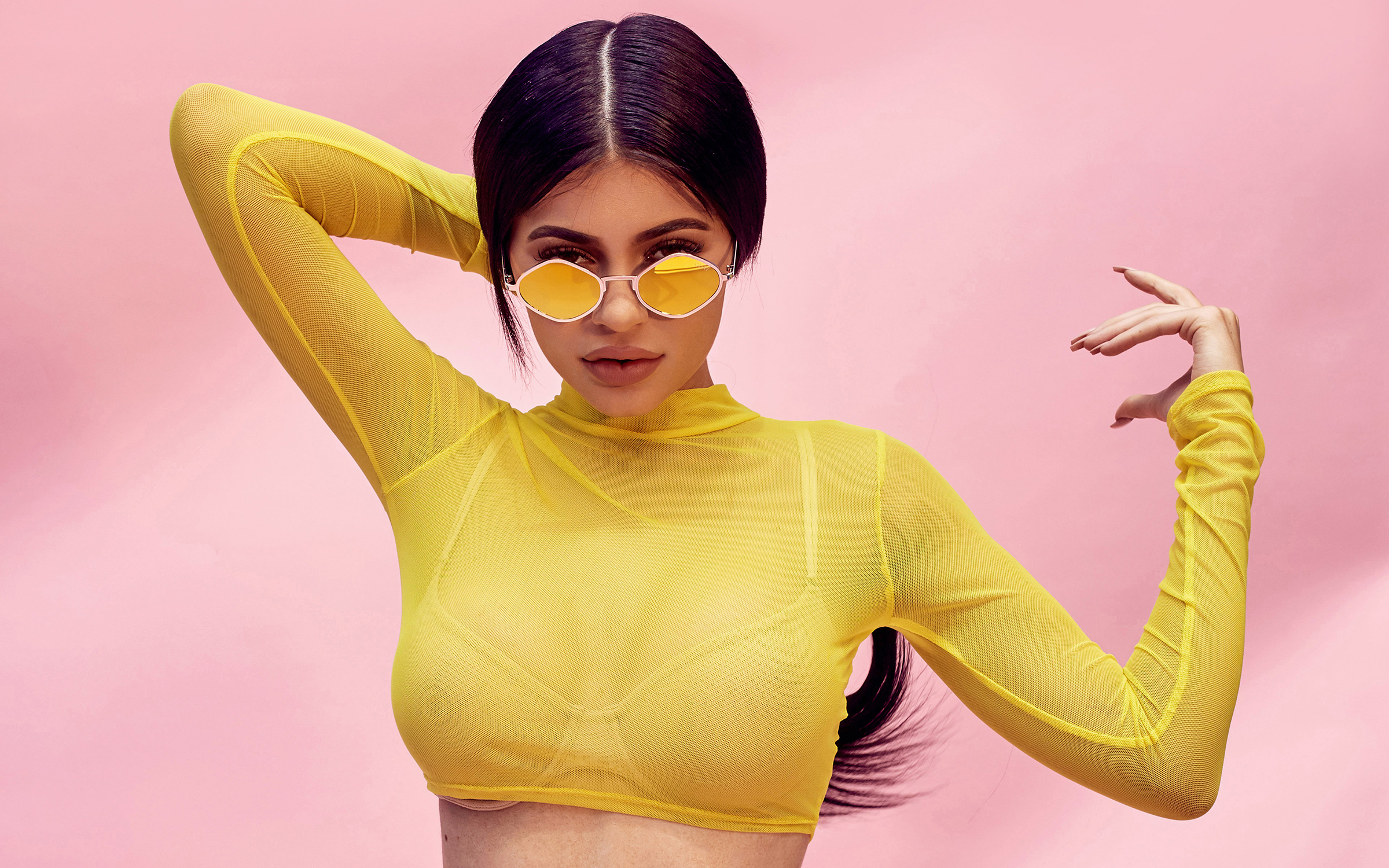 Kylie Jenner wearing a yellow top and sunglasses HD Wallpaper