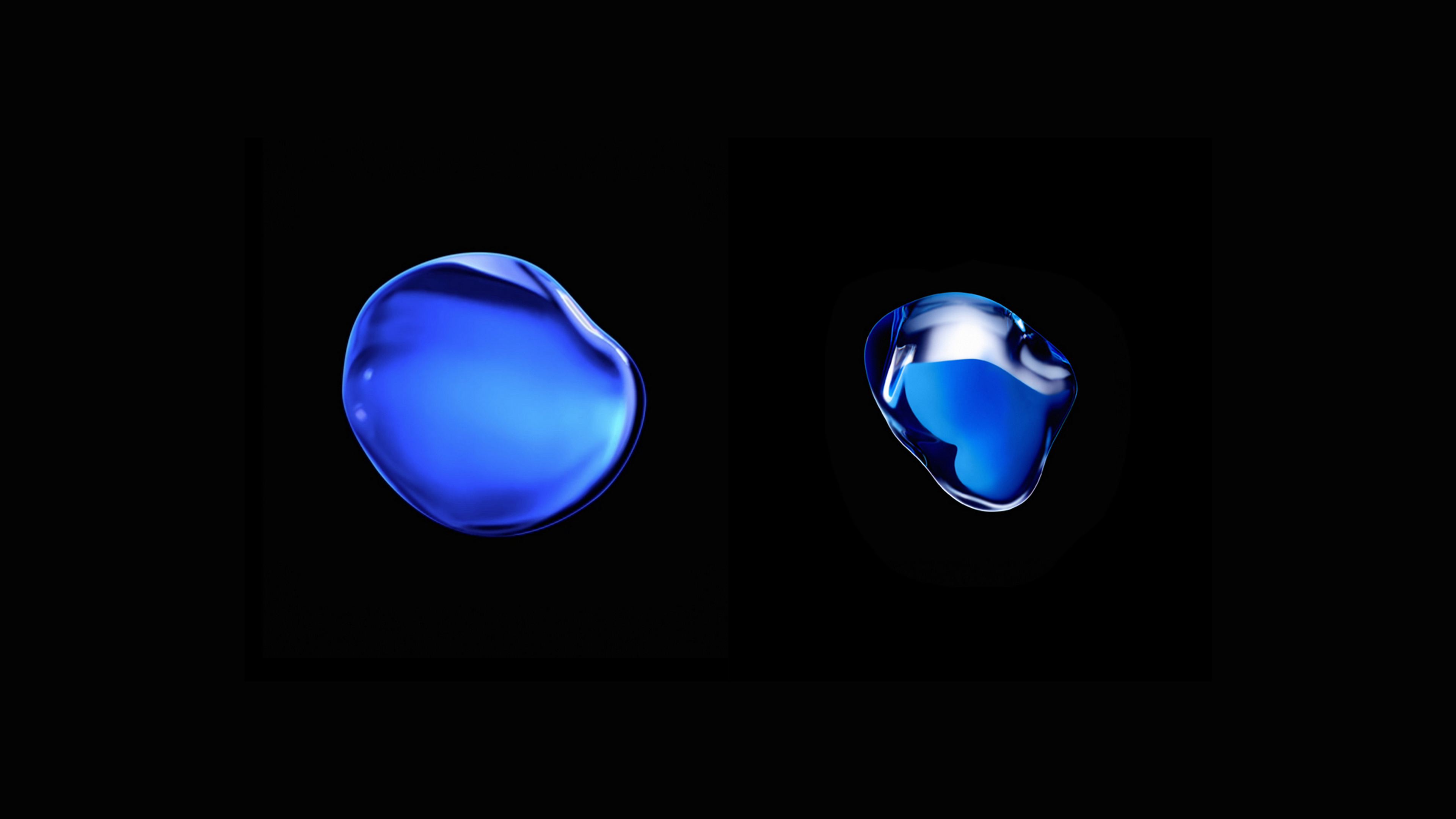 Two blue liquid drops on a black background HD Wallpaper