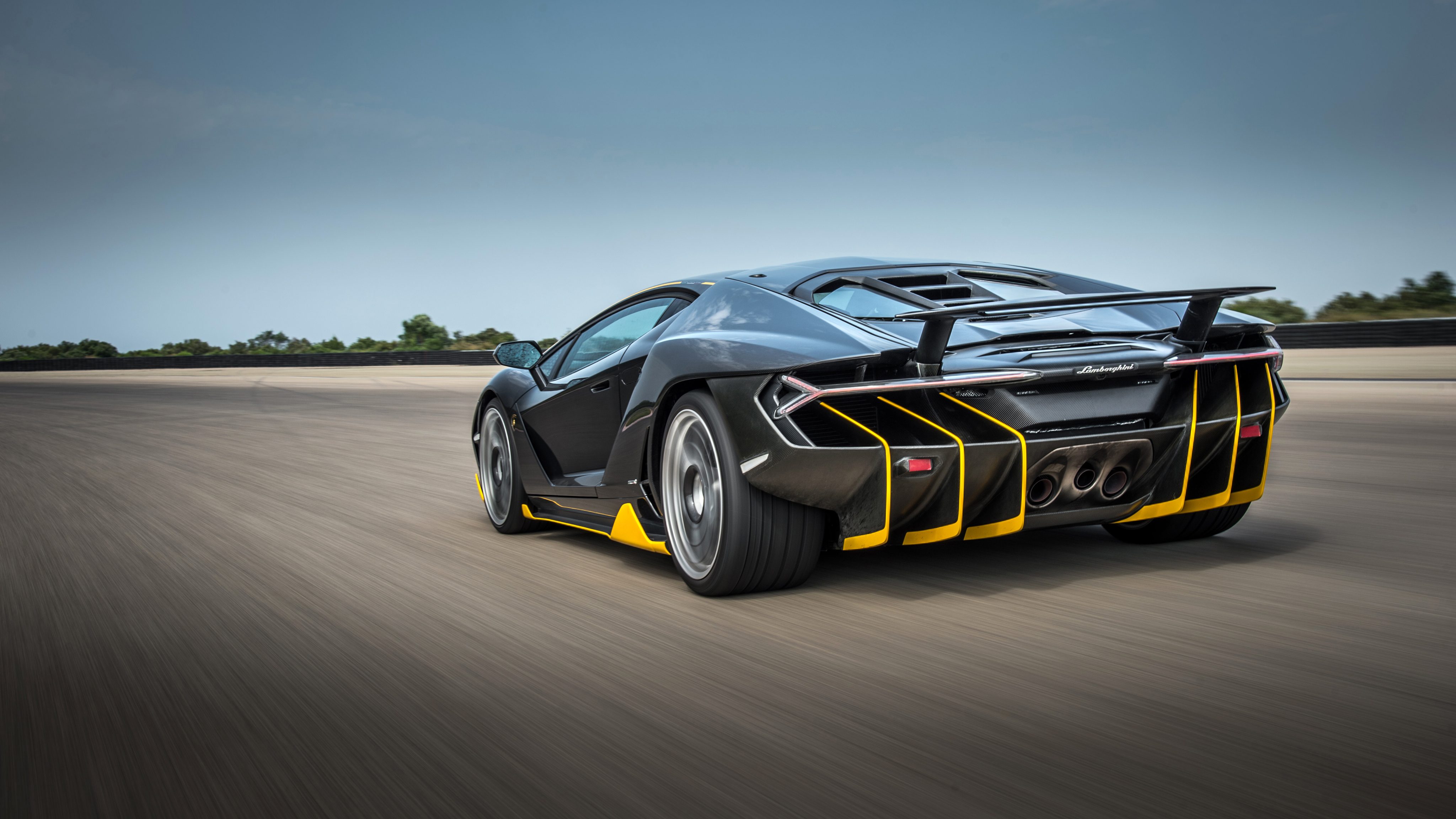 Lamborghini Centenario driving on a track HD Wallpaper