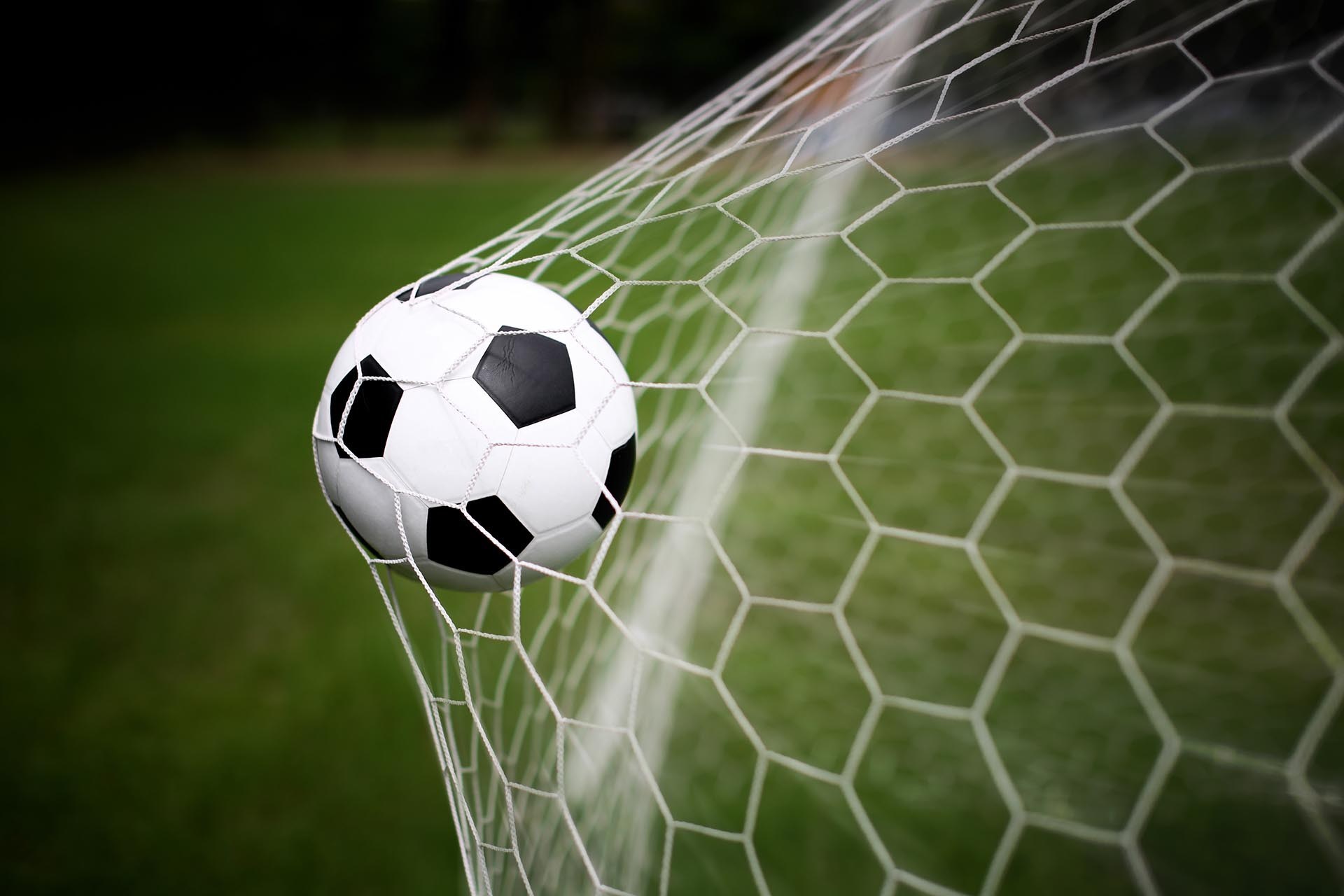 Soccer ball in a net HD Wallpaper