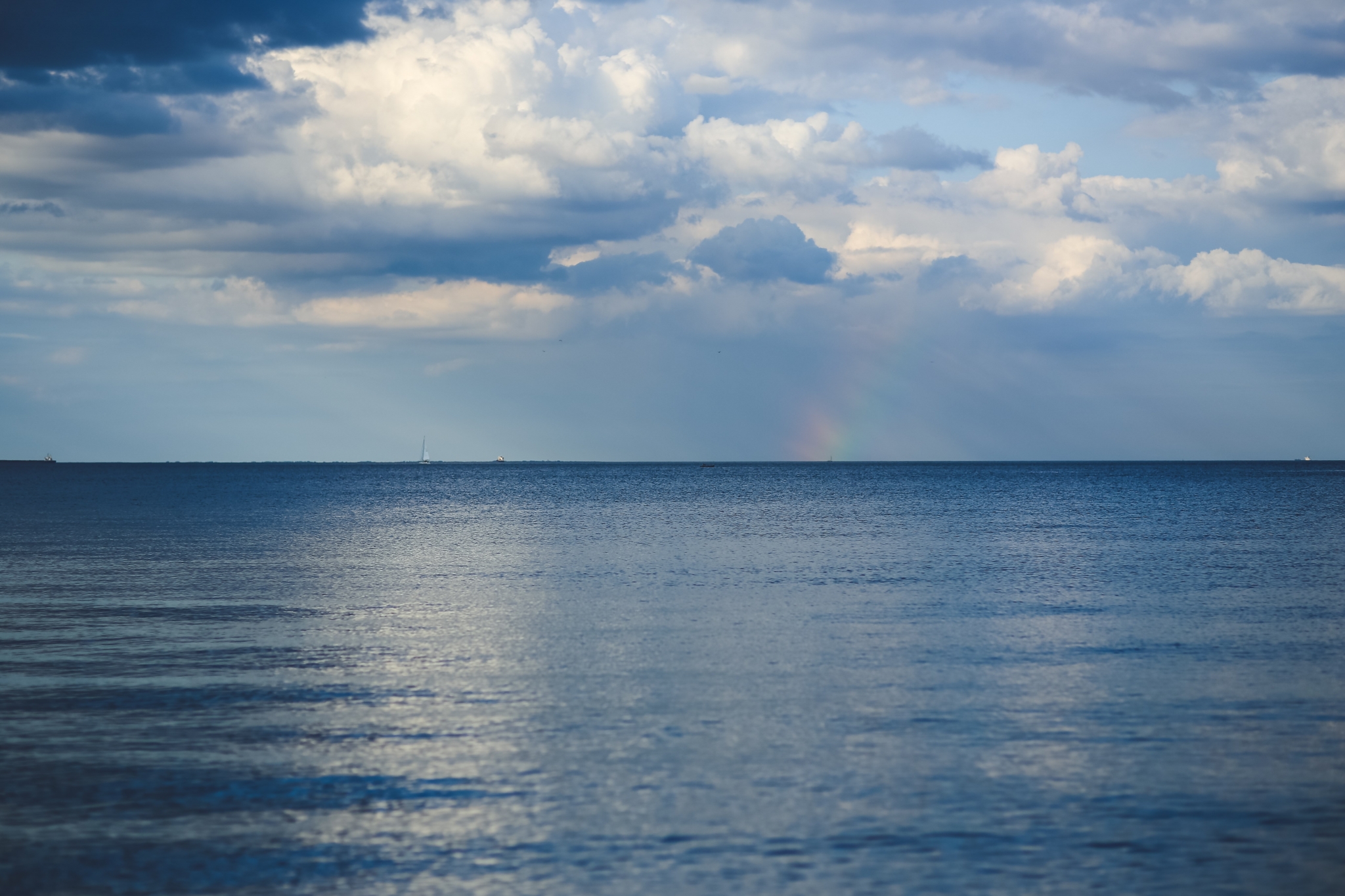 Ocean with clouds and rainbow HD Wallpaper