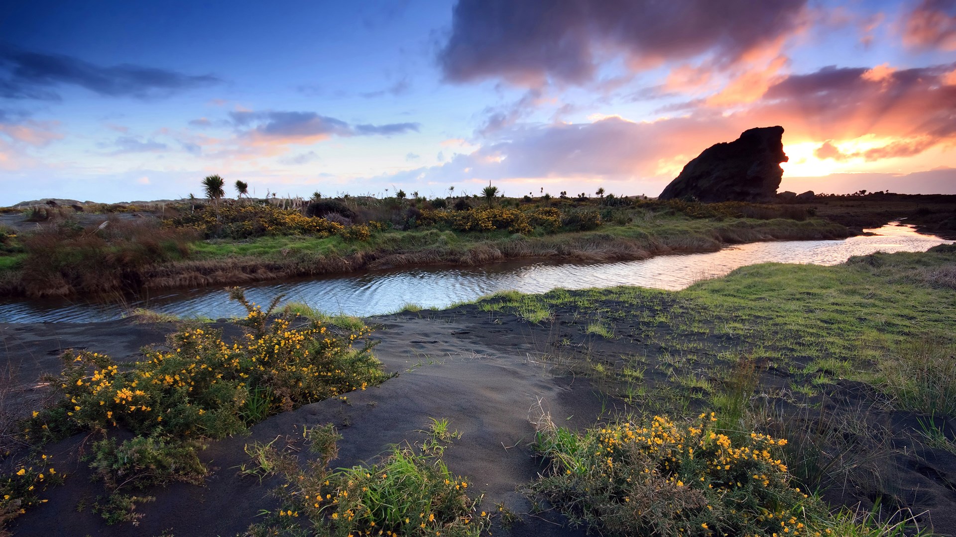 Coastal landscape with rock formation at sunset HD Wallpaper