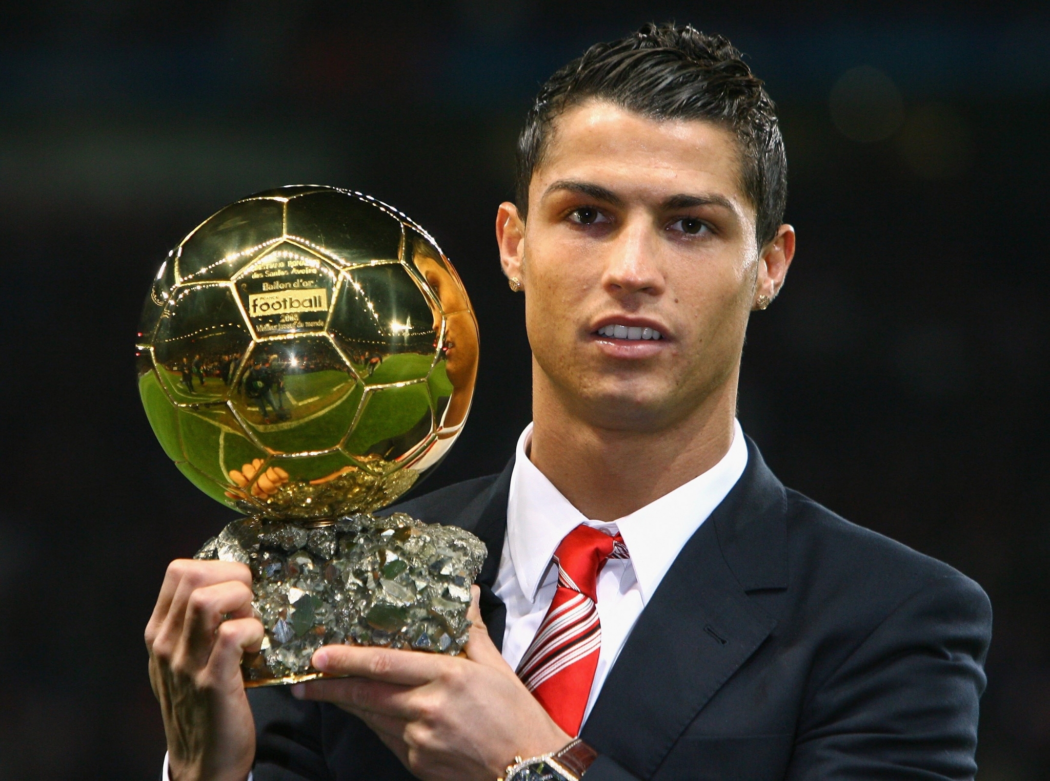 Cristiano Ronaldo holding the Ballon d'Or trophy HD Wallpaper