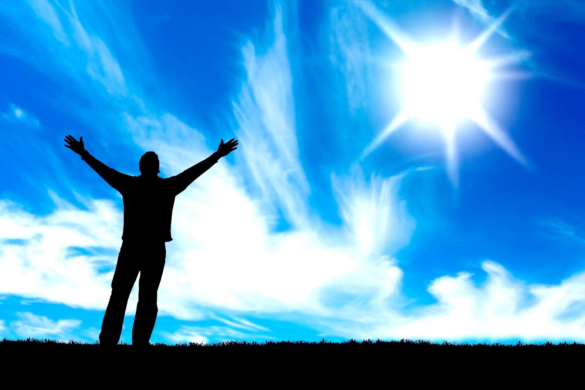 Silhouette of a person with arms raised towards the sun HD Wallpaper