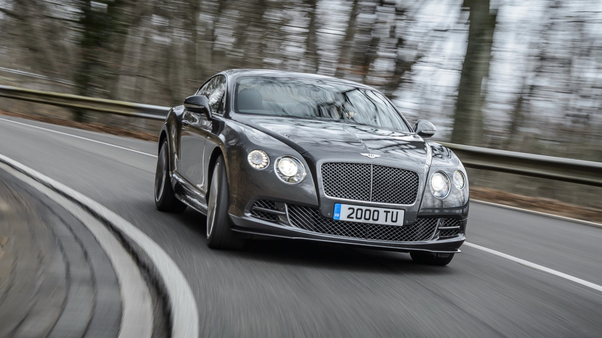 Bentley Continental GT Speed driving on a road HD Wallpaper