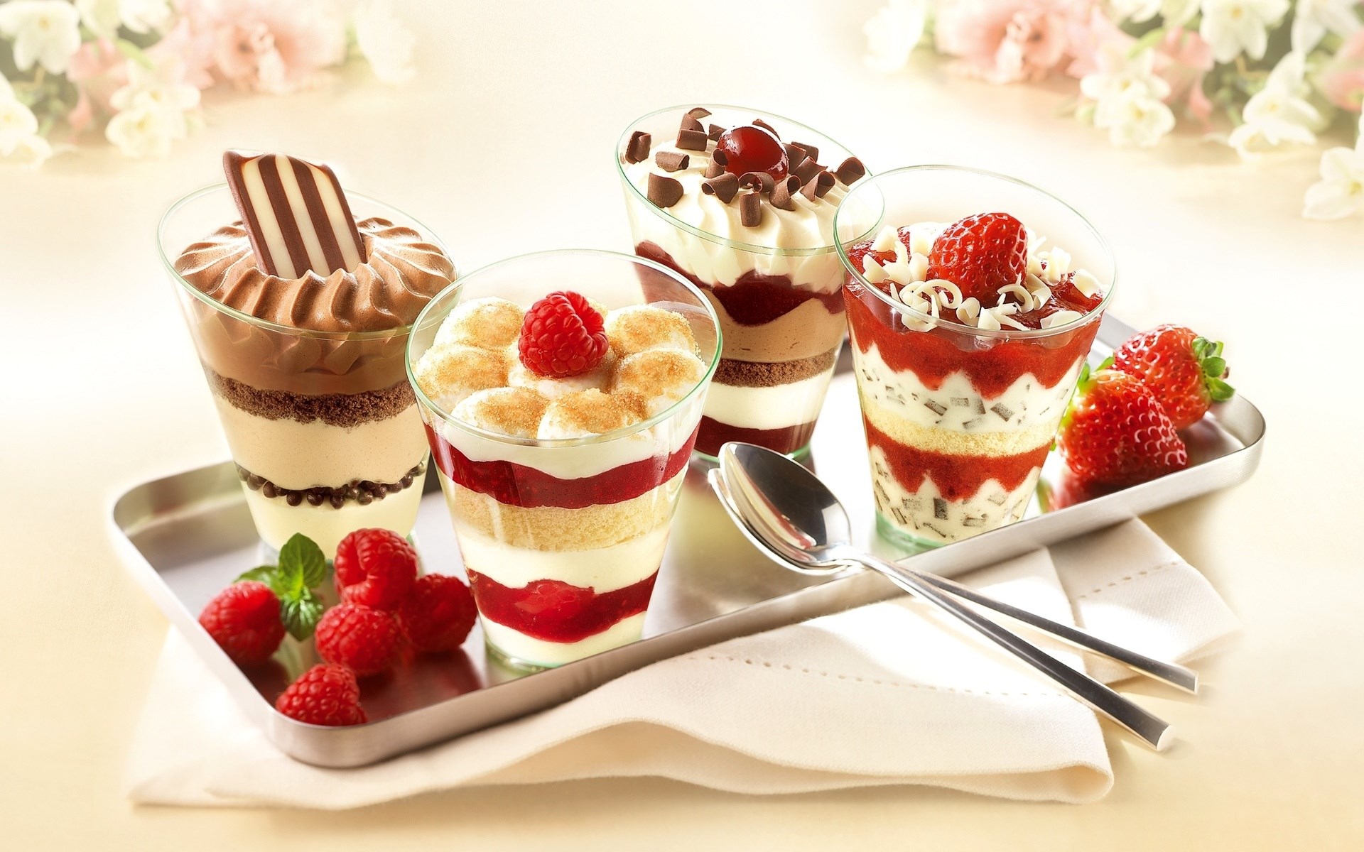 Four desserts on a tray with berries HD Wallpaper