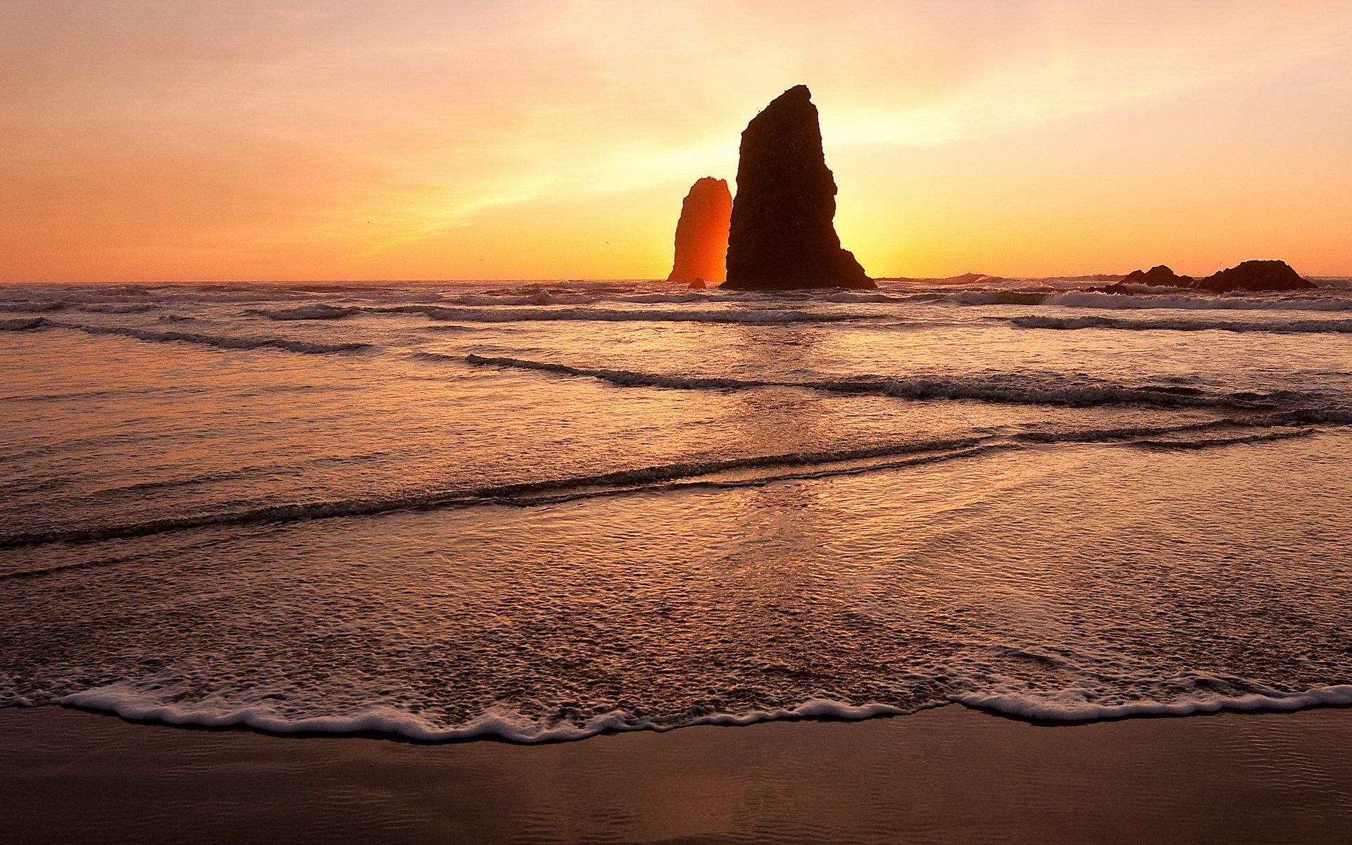Sea stacks at sunset on a beach HD Wallpaper