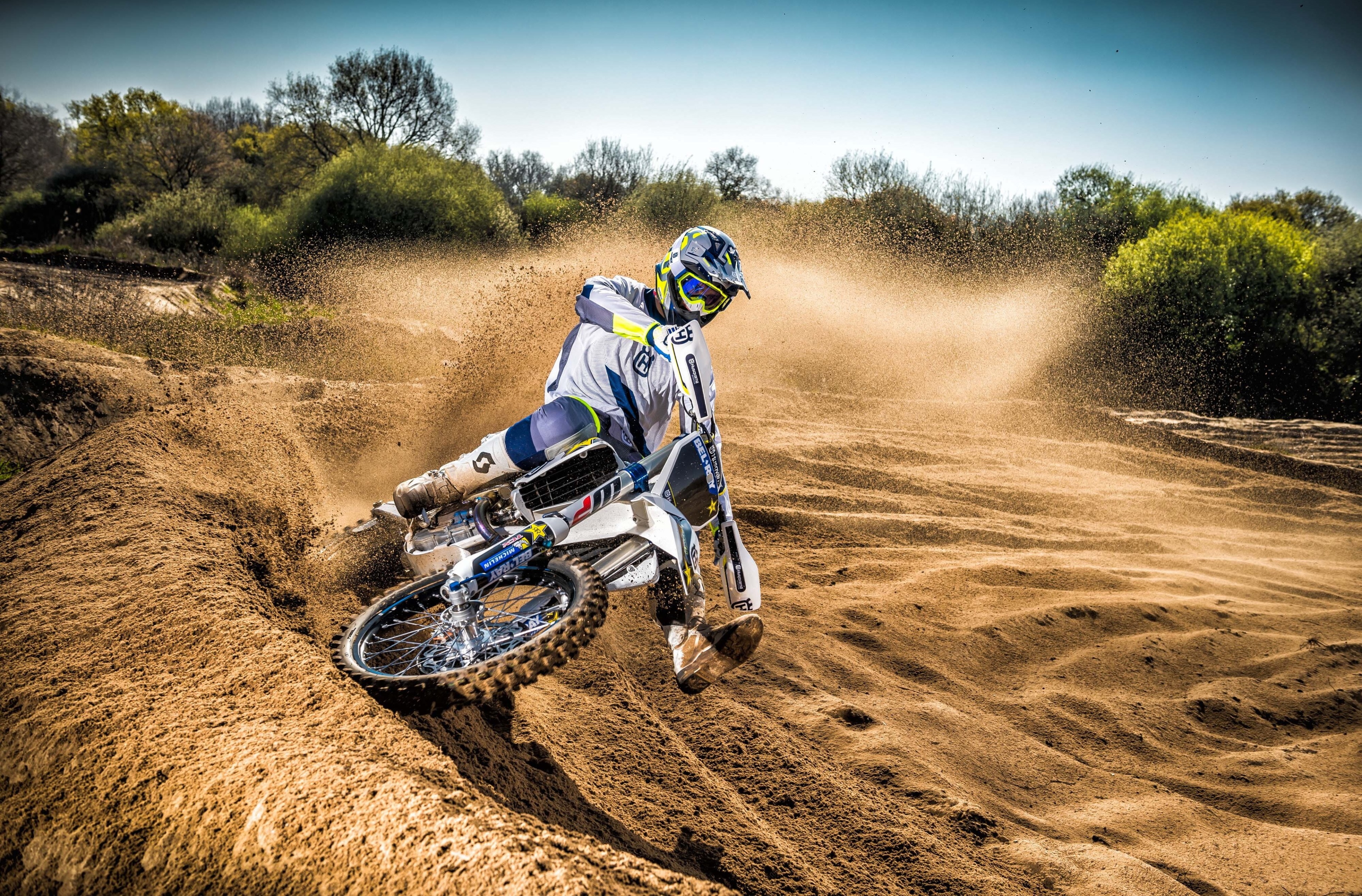 Husqvarna TC250 motocross rider kicking up dirt HD Wallpaper