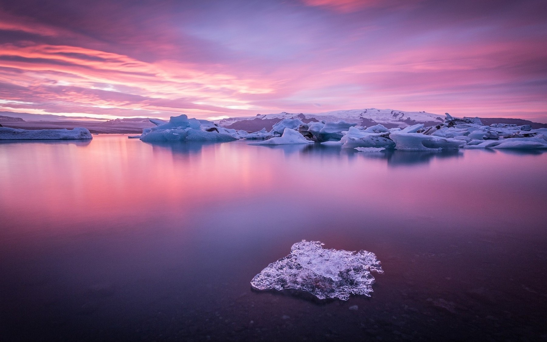 Icebergs on a lake during sunrise with colorful clouds HD Wallpaper