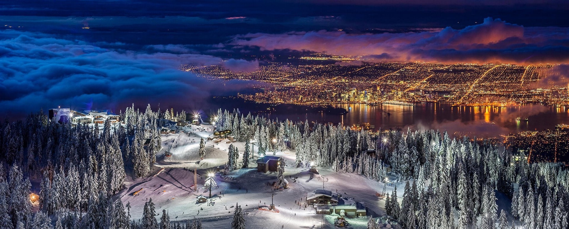 Vancouver cityscape at night from a snowy mountain ski resort HD Wallpaper