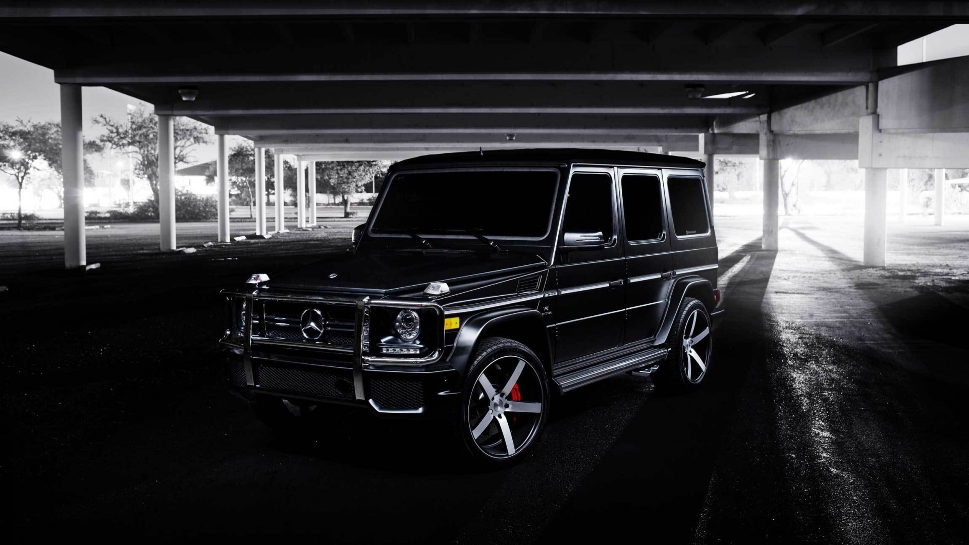Black Mercedes-Benz G-Wagon parked under a structure HD Wallpaper