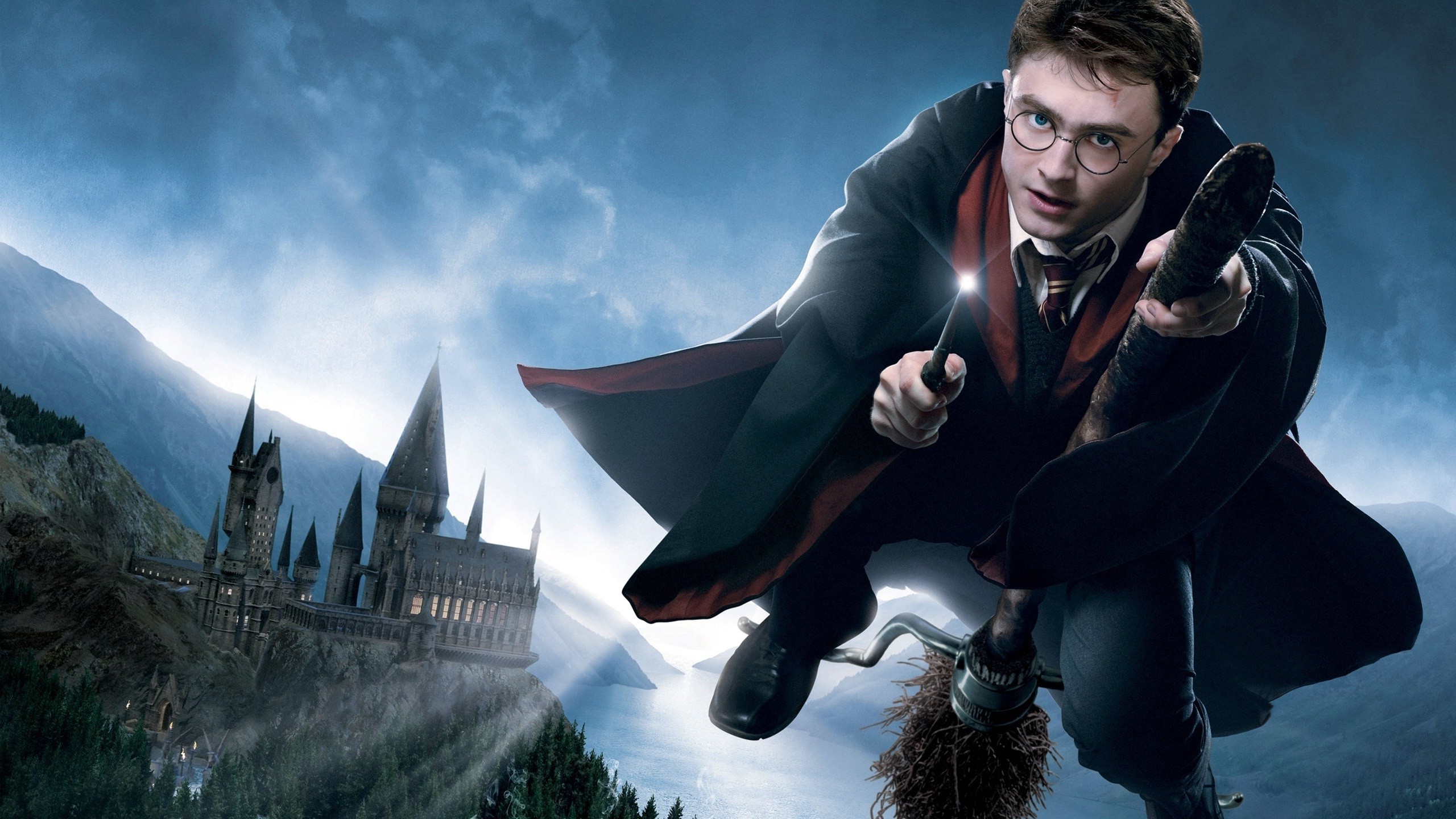 Harry Potter flying on a broomstick near Hogwarts HD Wallpaper