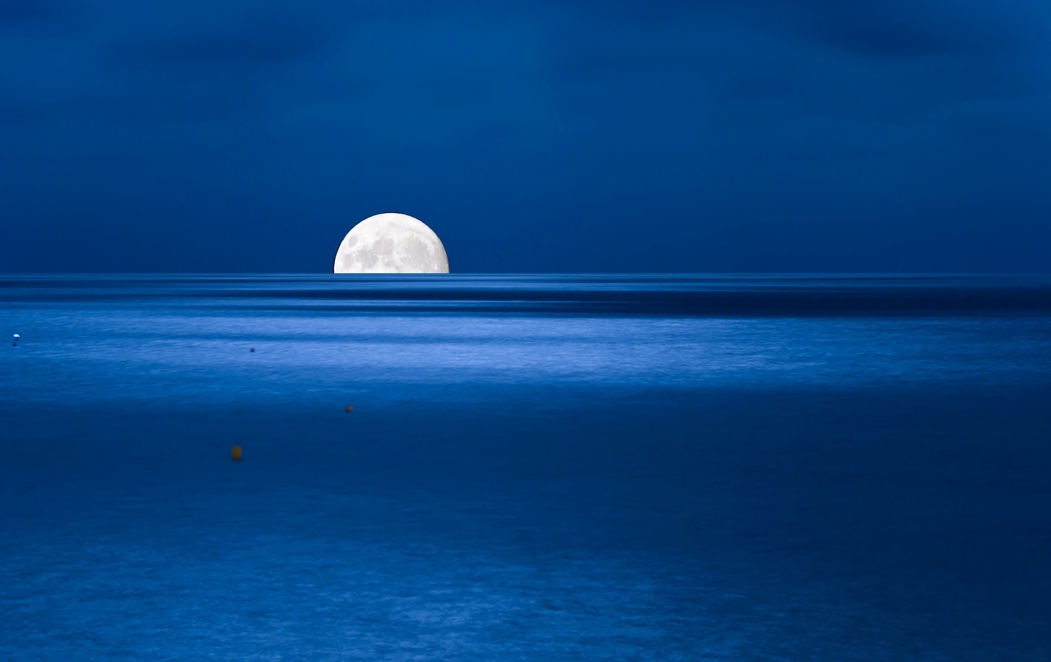 Half moon over the ocean at night HD Wallpaper