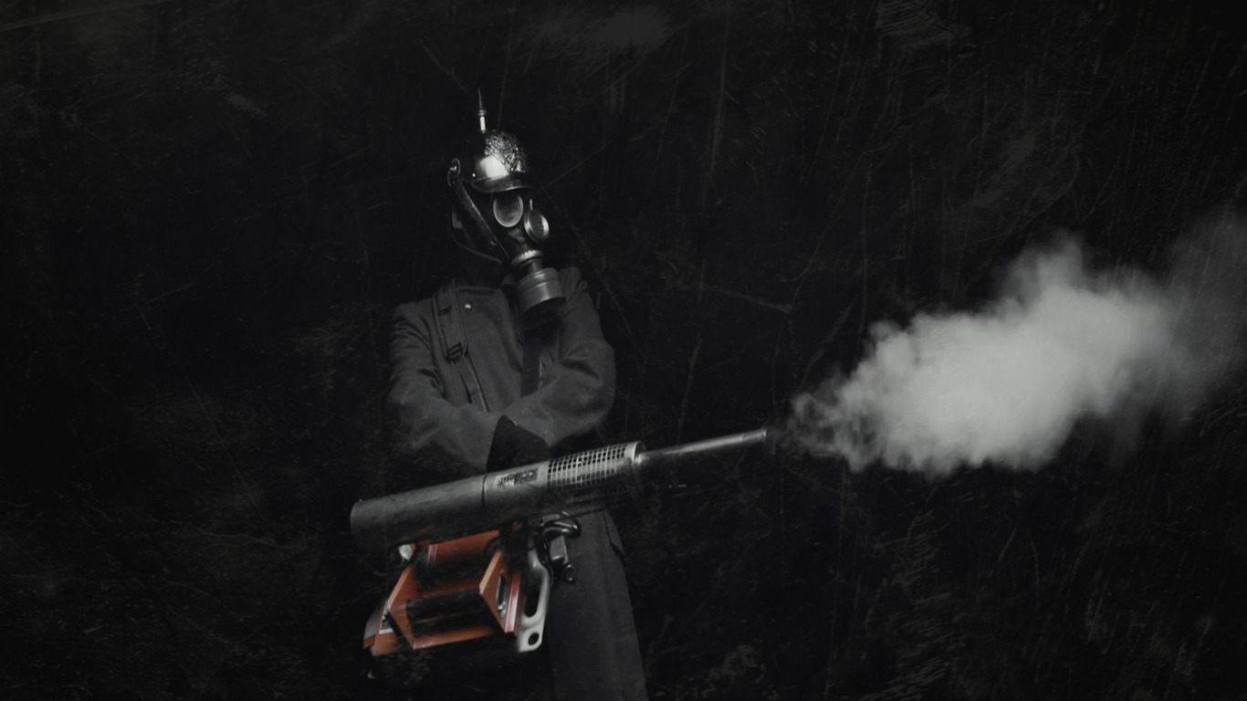 Soldier in gas mask and helmet with flamethrower HD Wallpaper