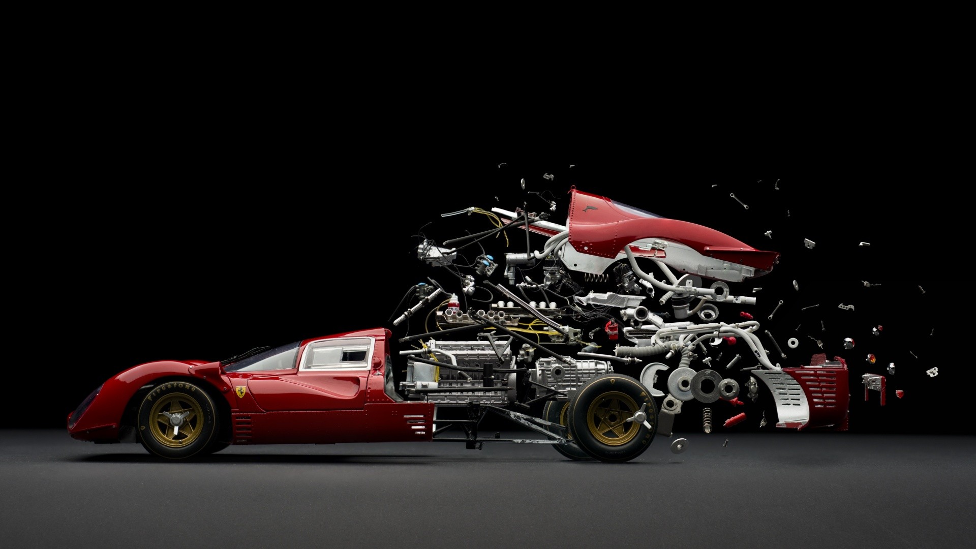 Exploded view of a red Ferrari sports car HD Wallpaper